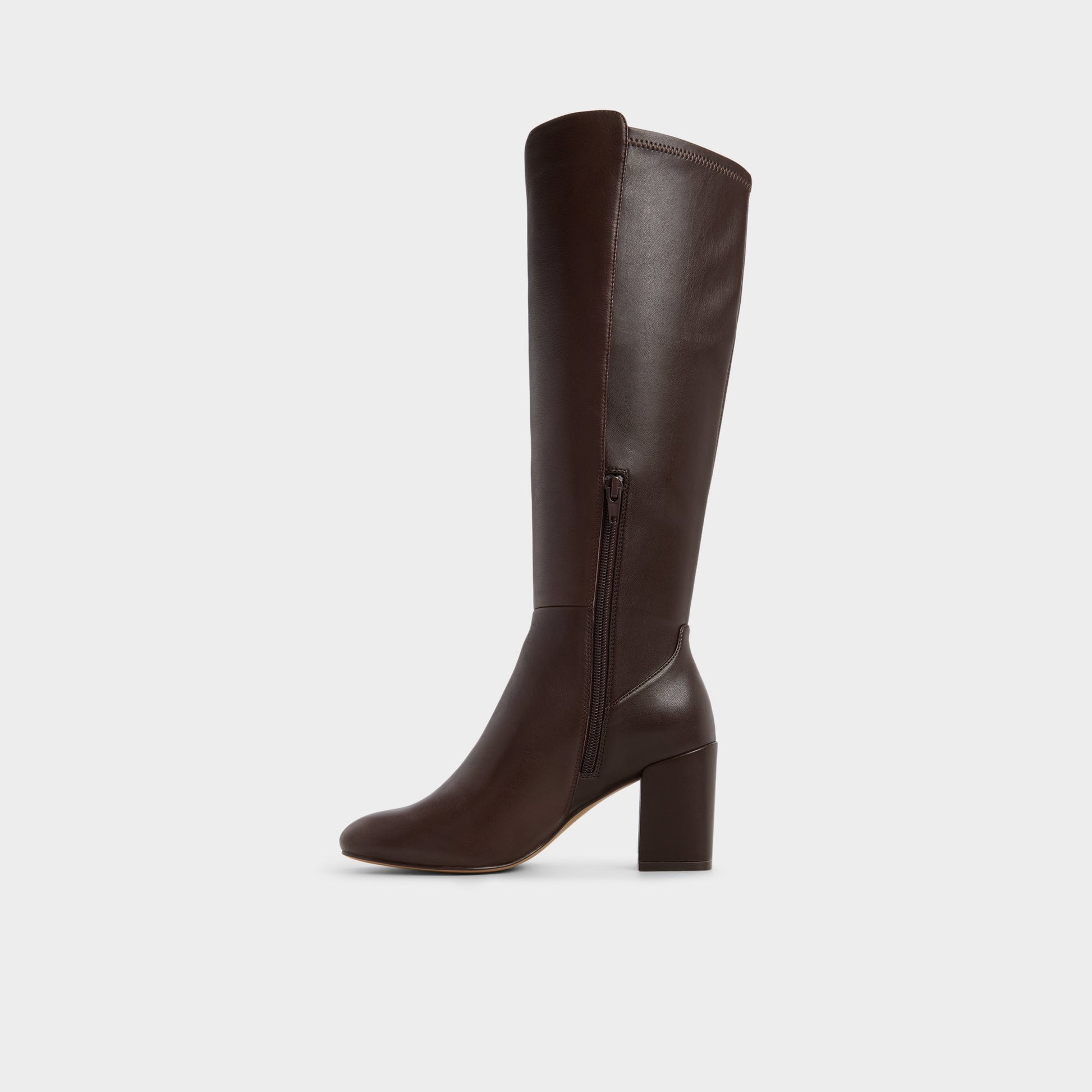 Side view of Brown overflow Satori Knee-high boot