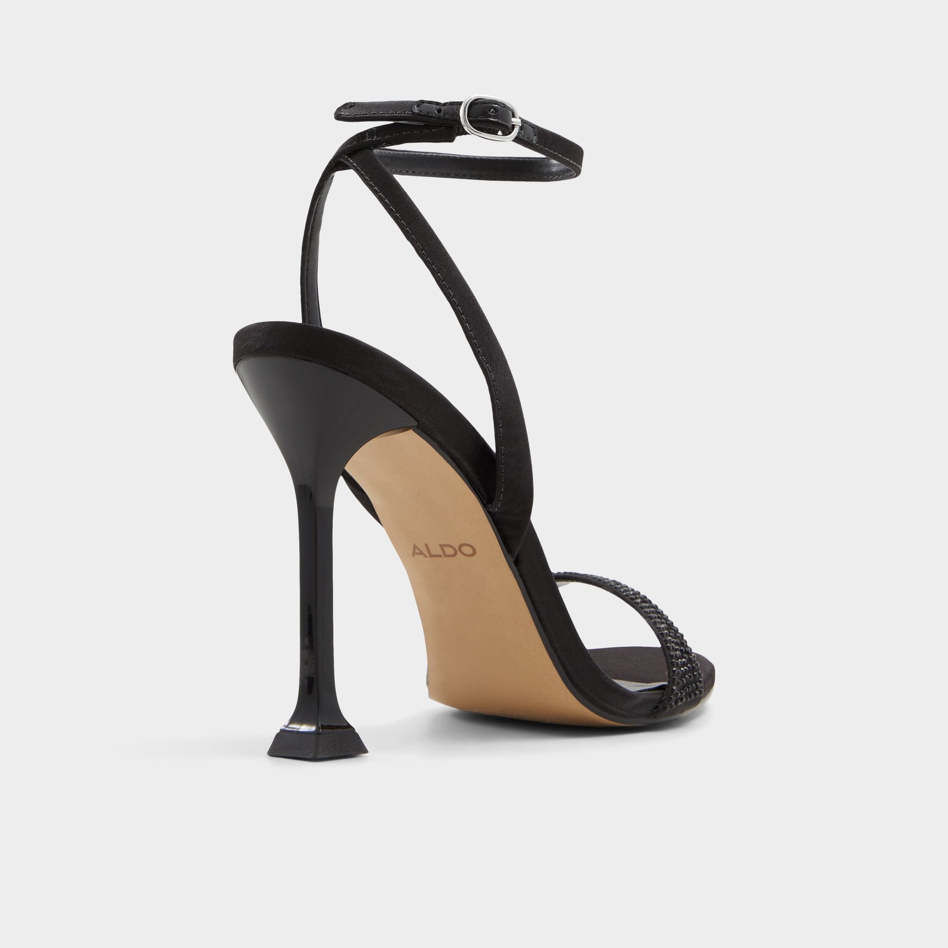 Three-quarter angle of Black Lydala Strappy heeled sandal's back side