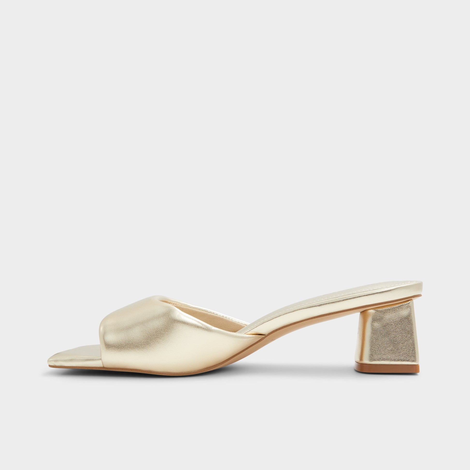Side view of Gold Aneka Heeled mule