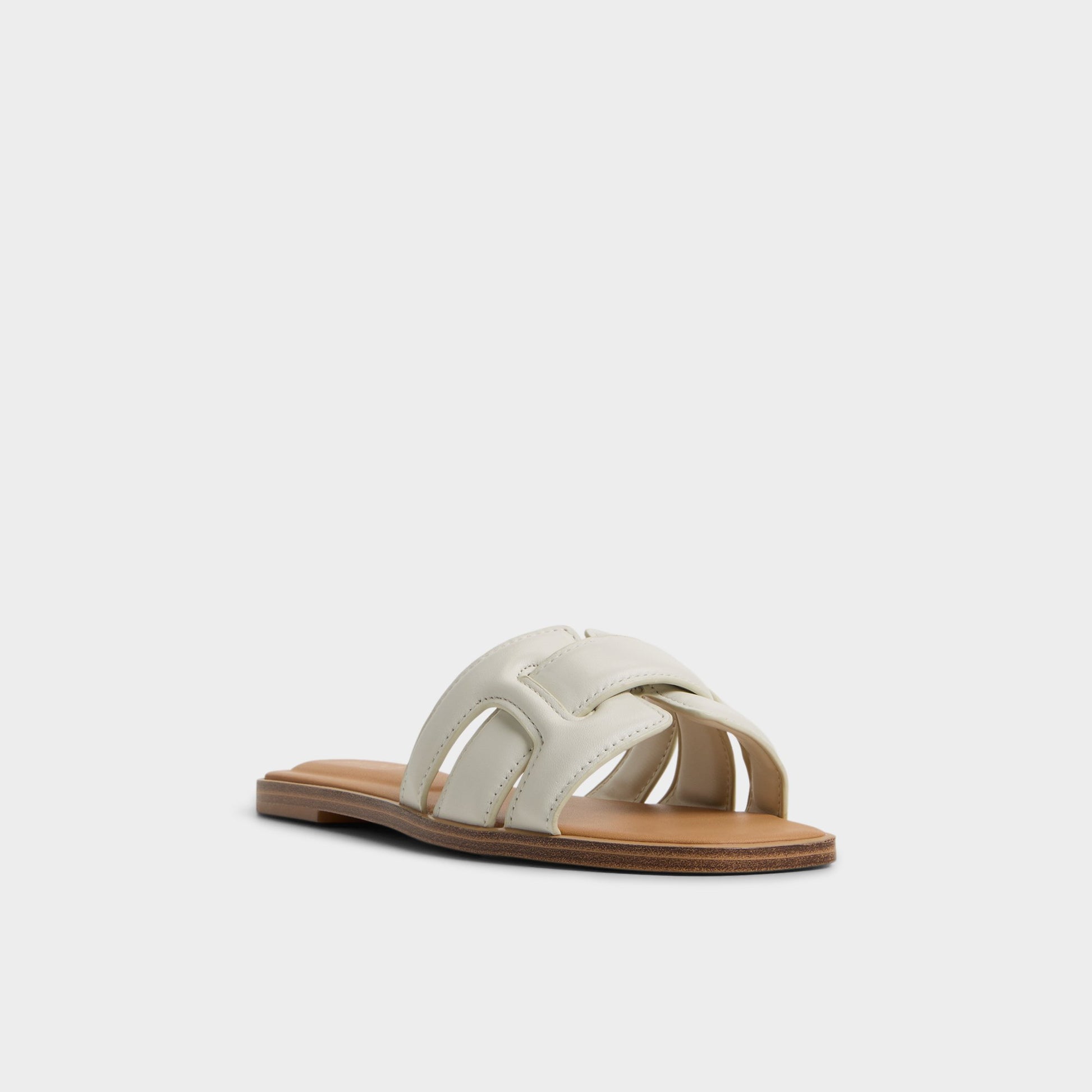 Three-quarter angle of White/Bone Elenaa Slide sandal's front side