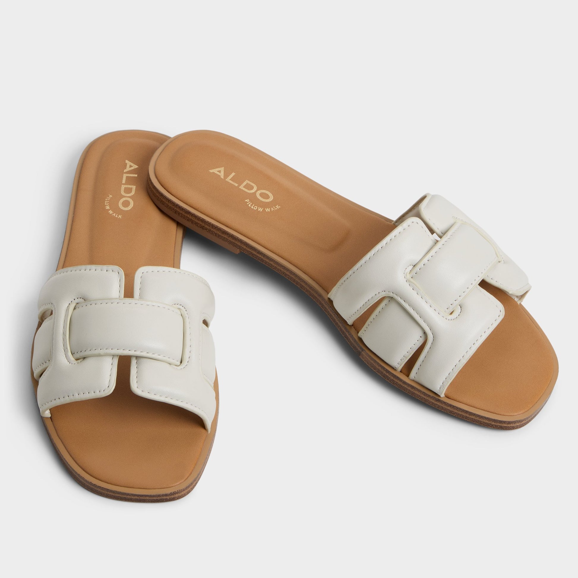 Highlighted view of a pair of White/Bone Elenaa Slide sandals