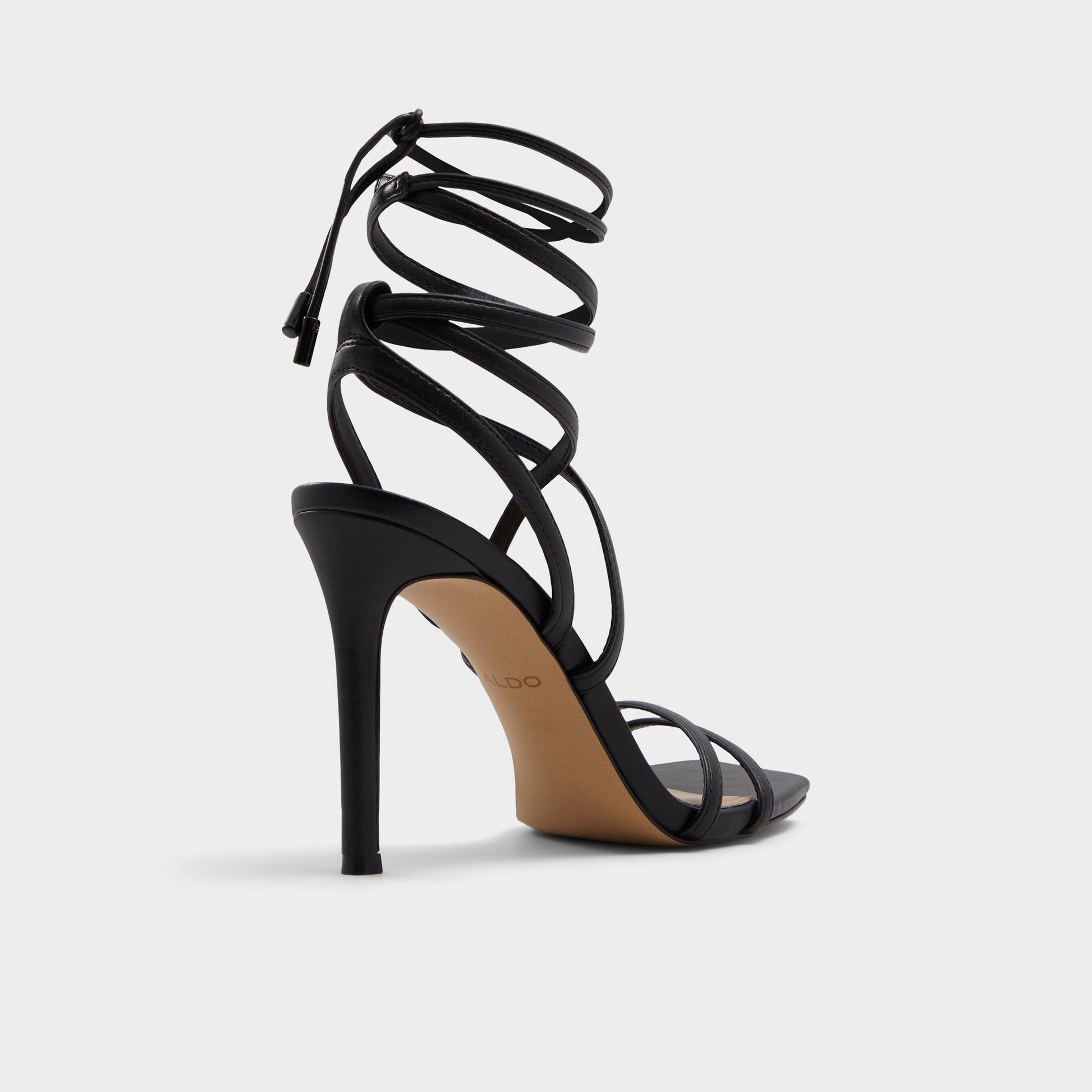 Three-quarter angle of Black Phaedra Black strappy stiletto sandal's back side