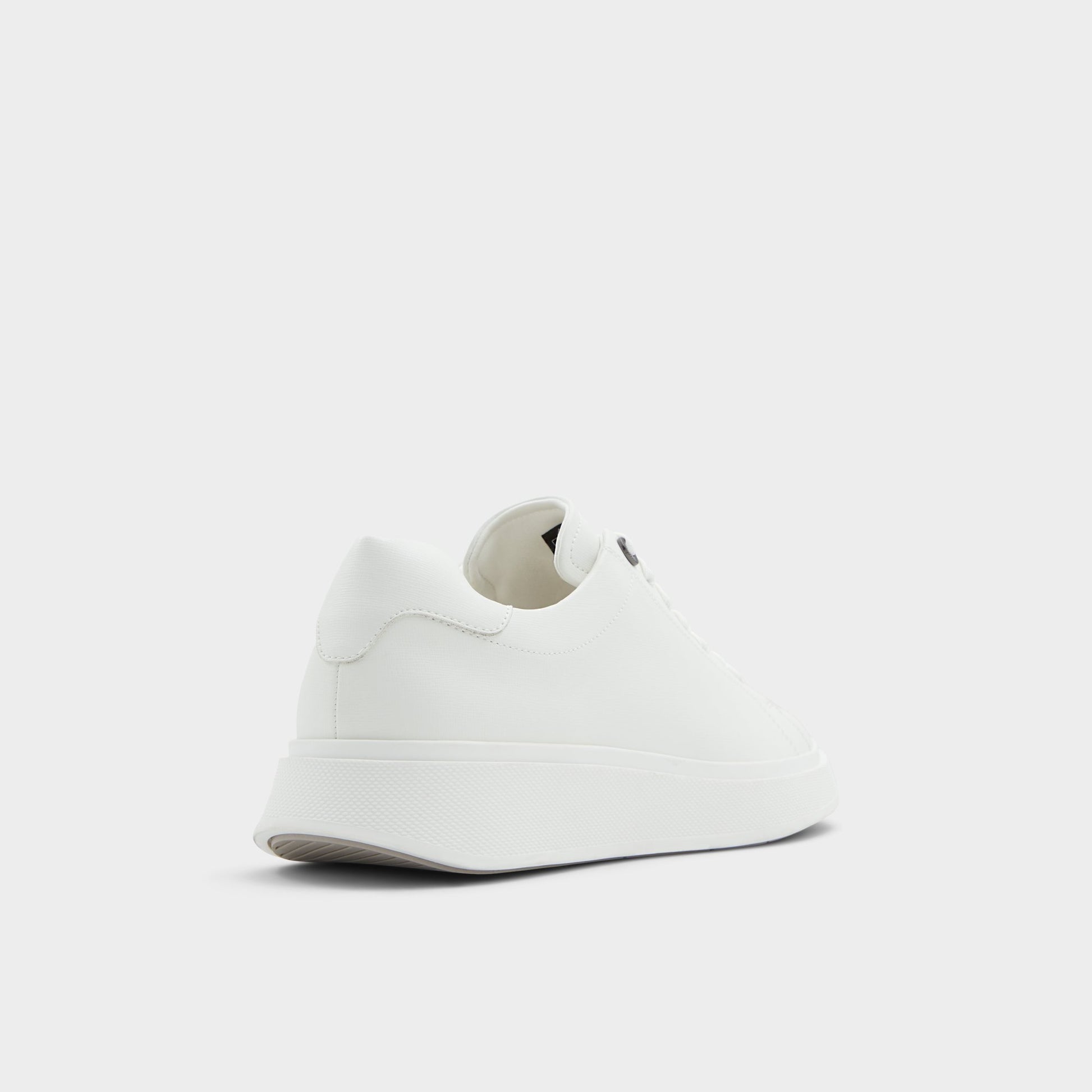 Three-quarter angle of Natural Magnus Low top sneaker's back side