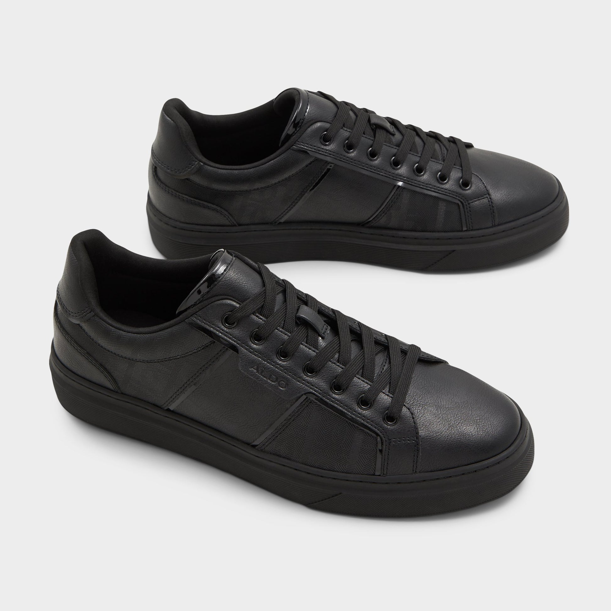 Highlighted view of a pair of Other black Courtline Low top sneakers