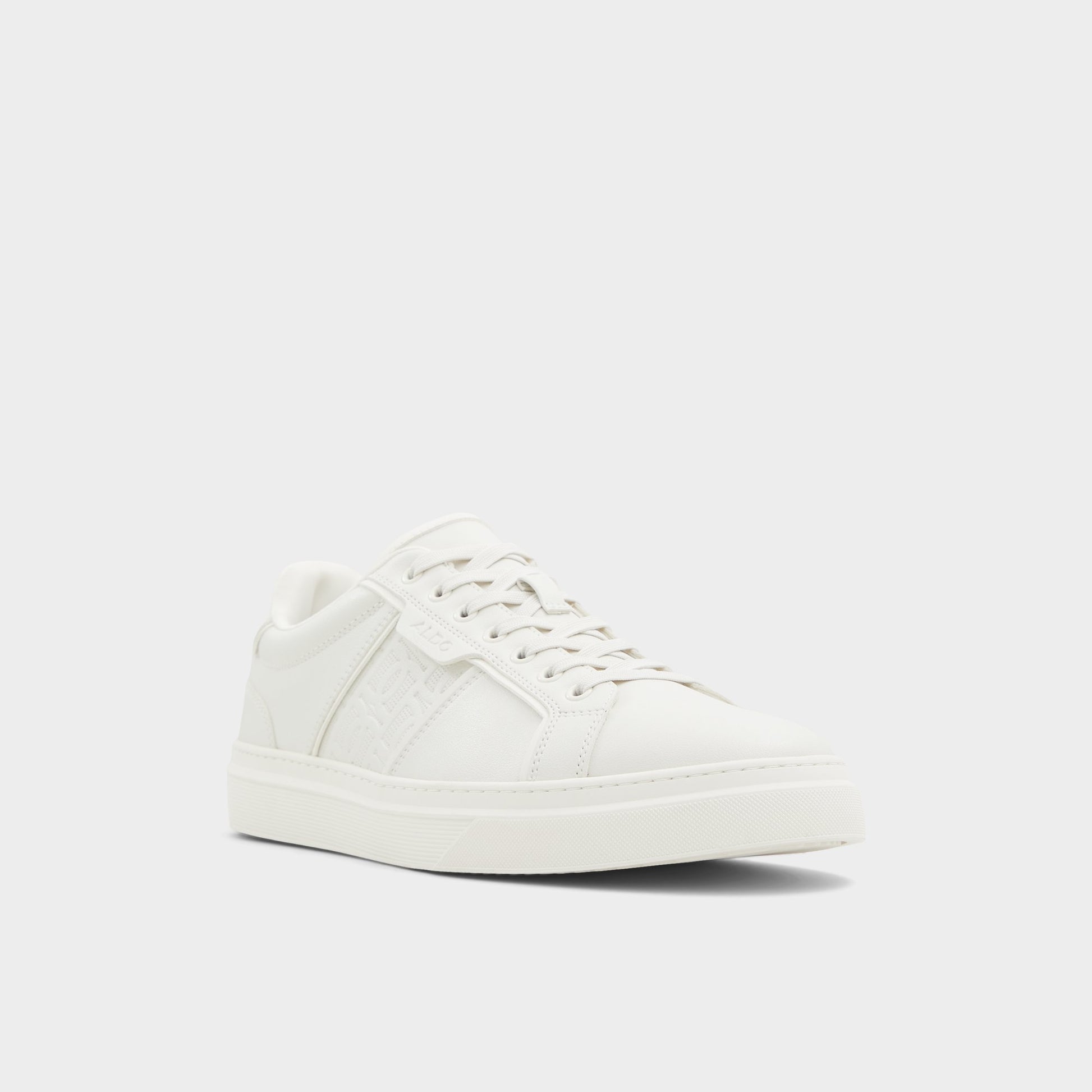 Three-quarter angle of White/Bone Courtline Low top sneaker's front side