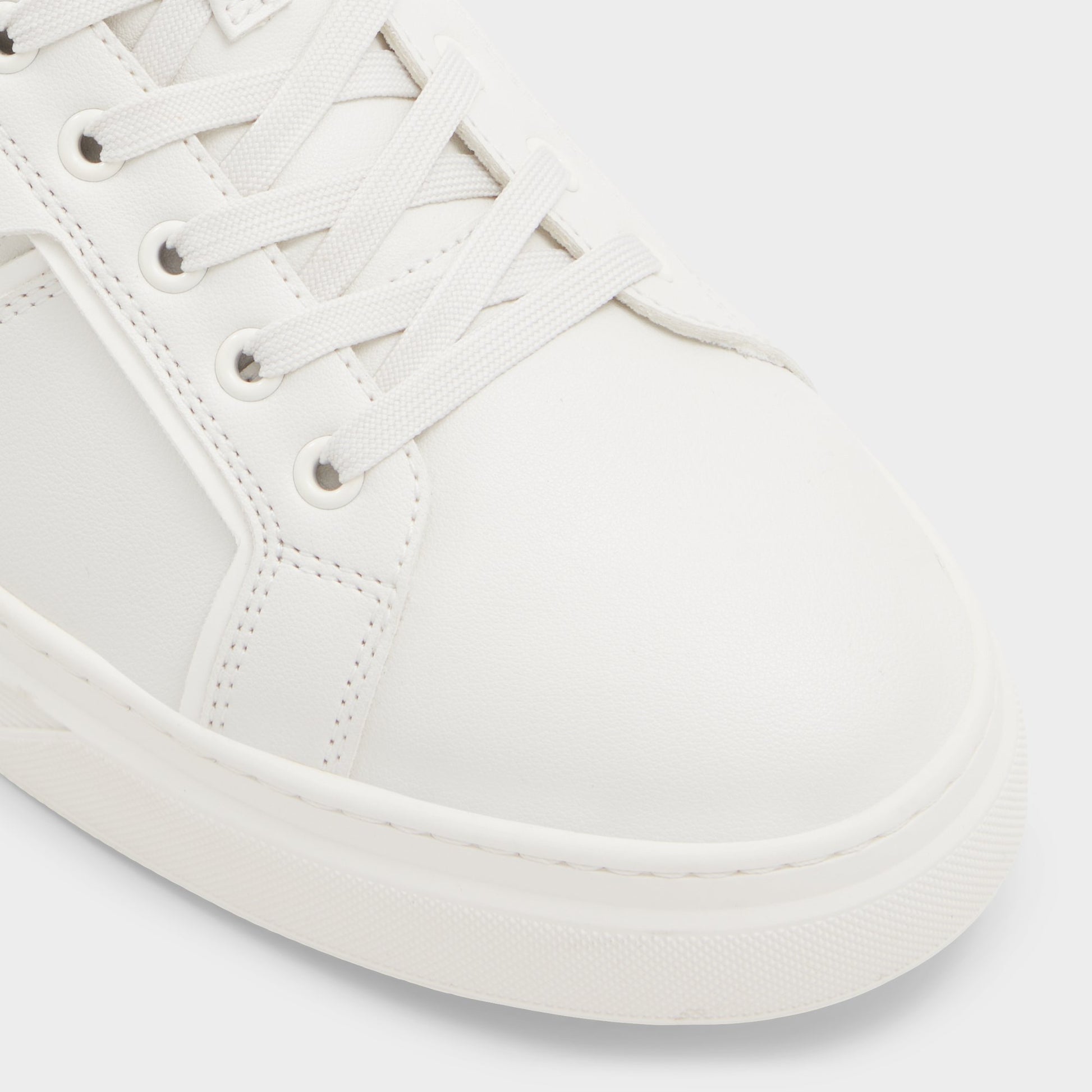 Close-up of the White/Bone Courtline Low top sneaker