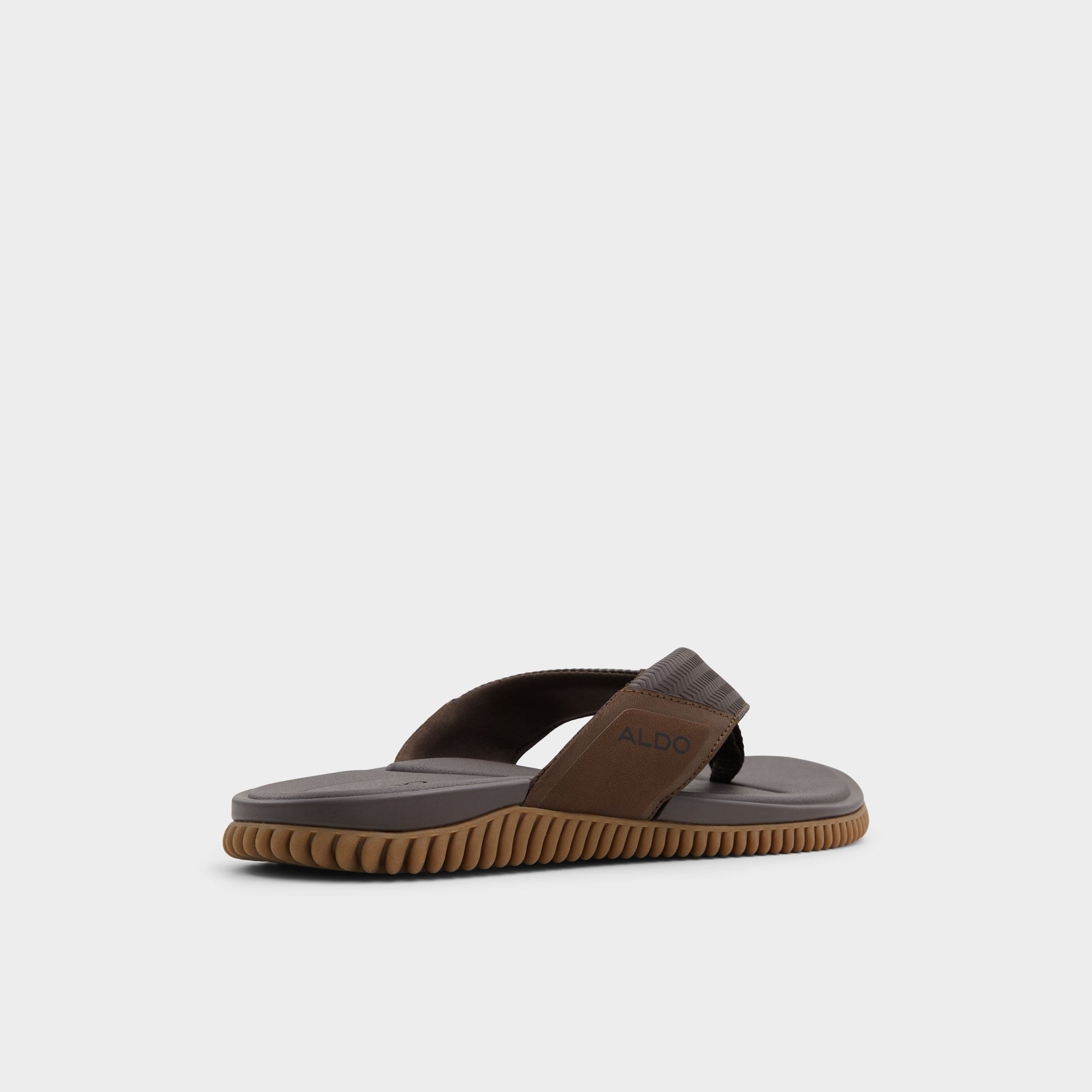 Three-quarter angle of Other brown Riptide Flip flop's back side