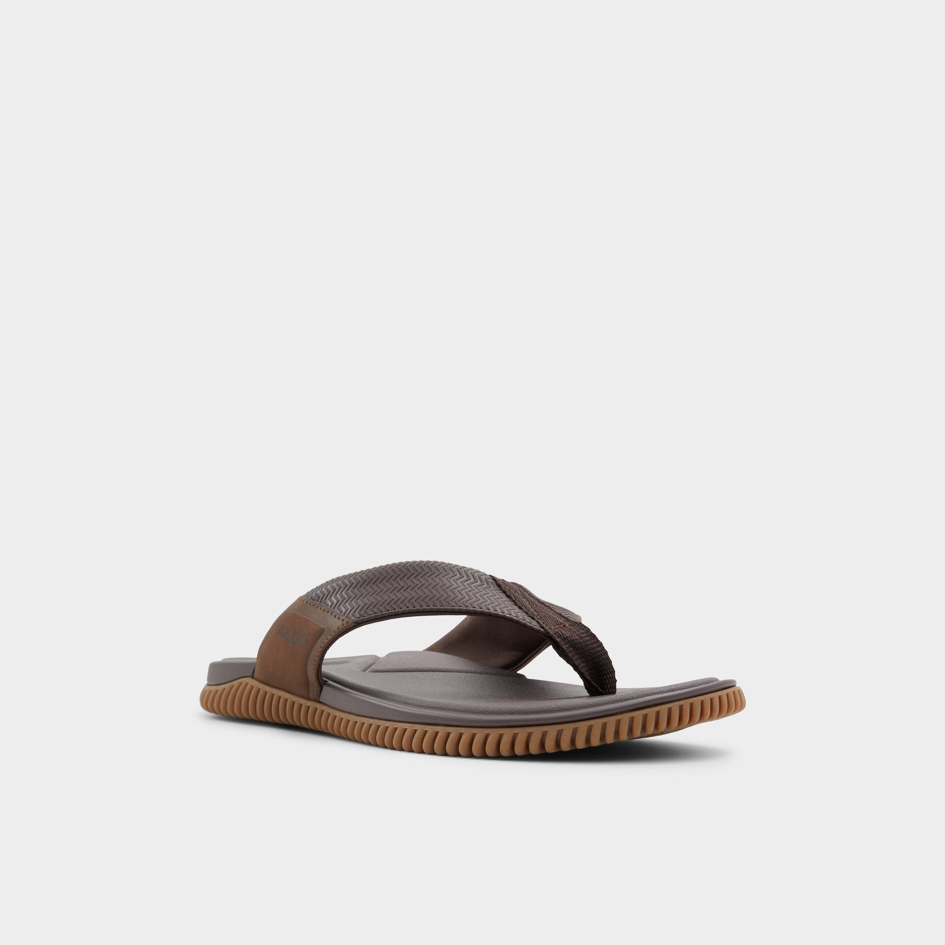 Three-quarter angle of Other brown Riptide Flip flop's front side