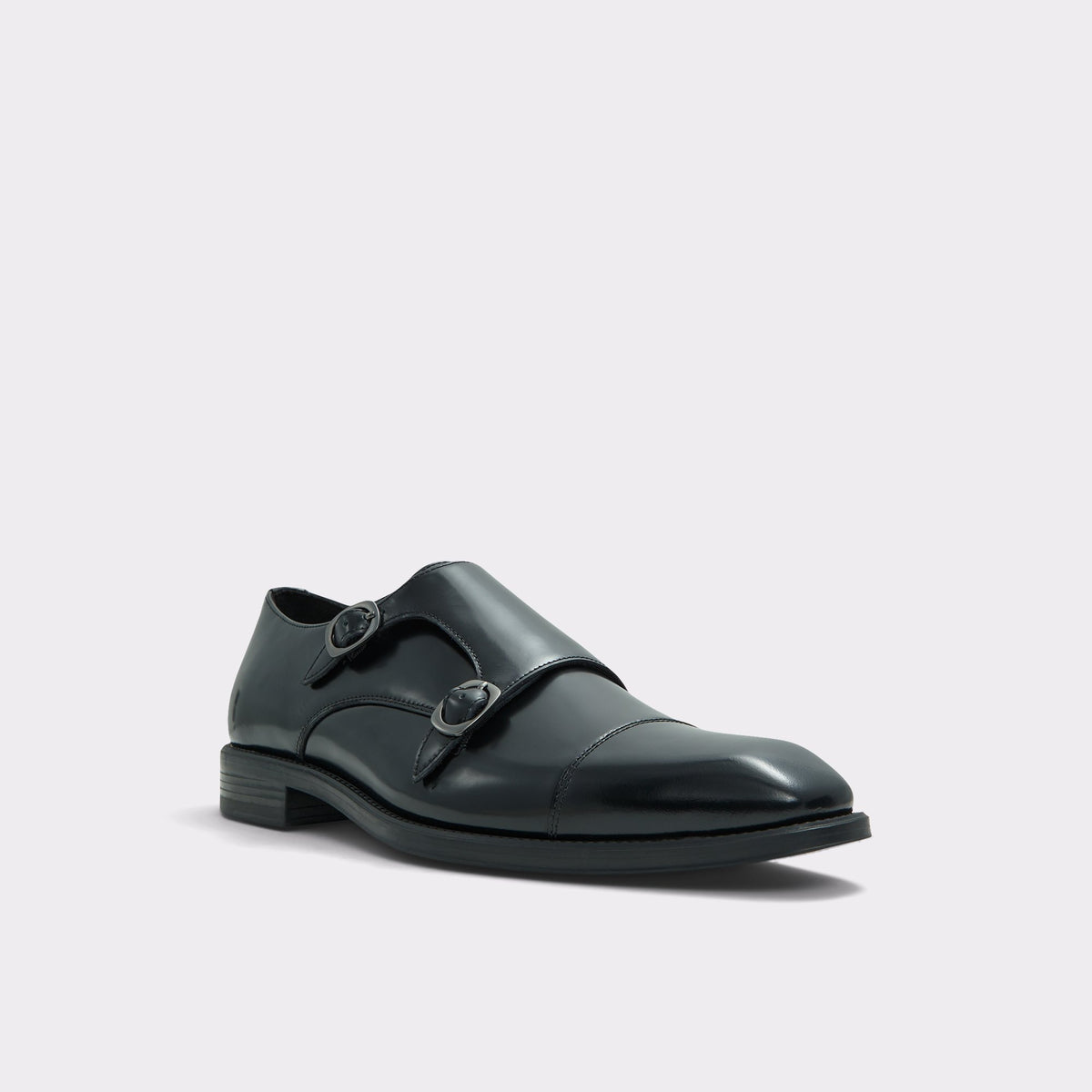 Angle de trois quarts de la face avant de Noir Chip Mocassin double boucle