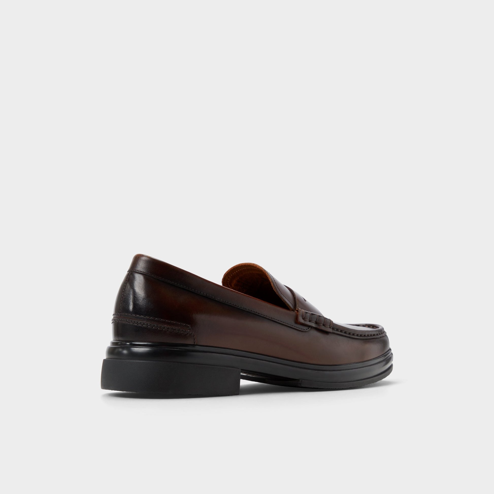 Three-quarter angle of Other Brown Tucker Loafer's back side