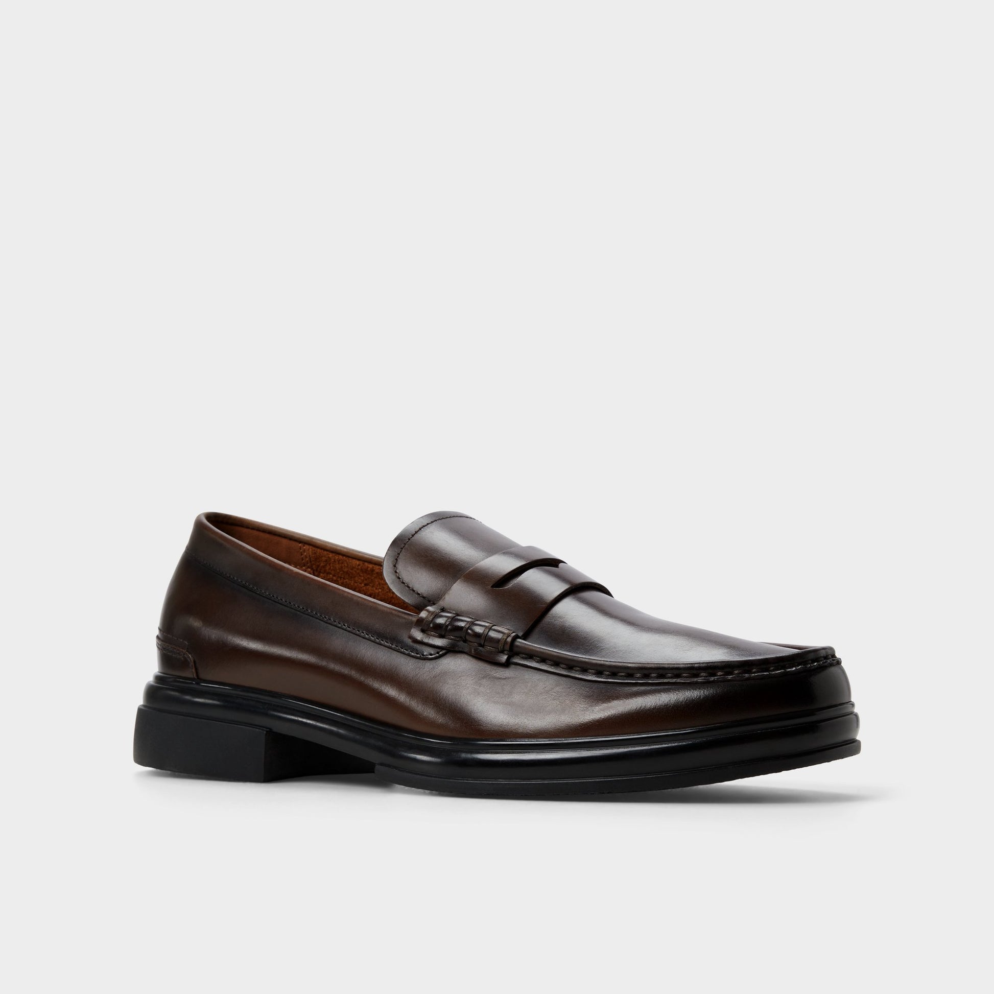 Three-quarter angle of Other Brown Tucker Loafer's front side