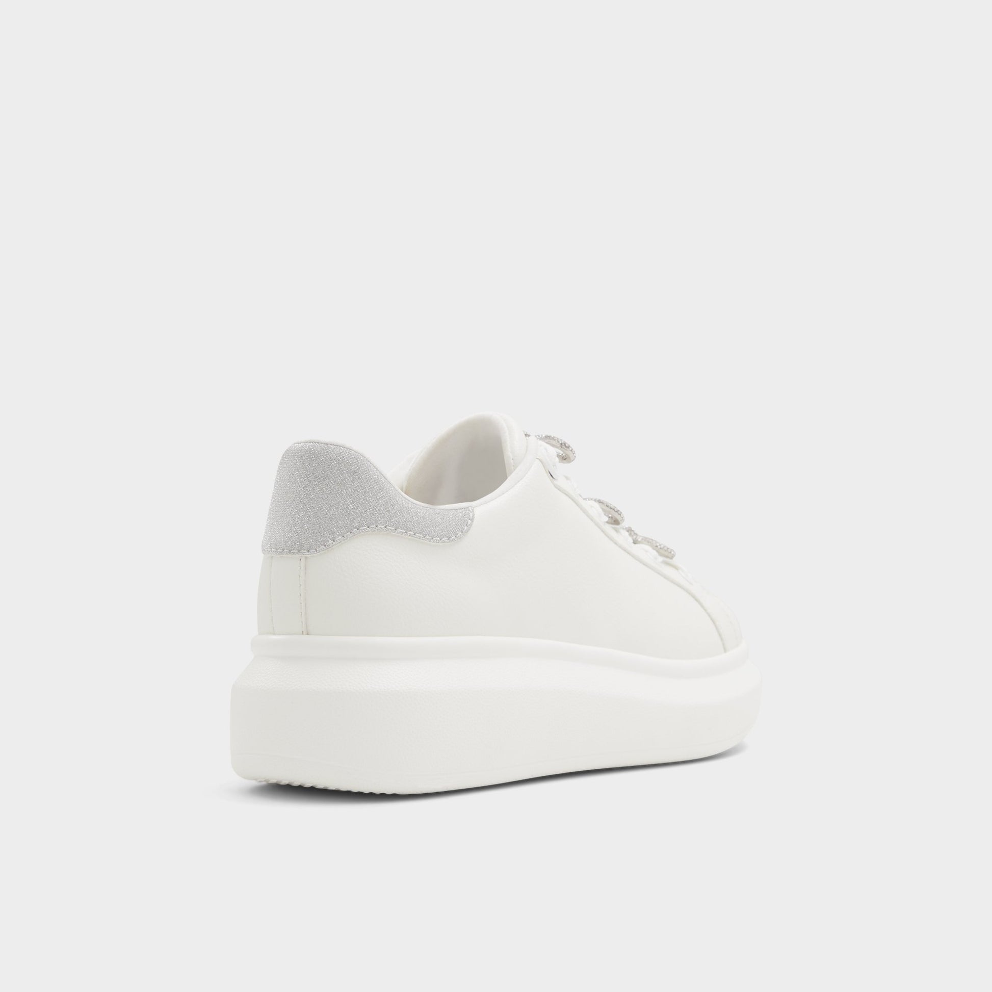 Three-quarter angle of White Merrick Low top sneaker's back side