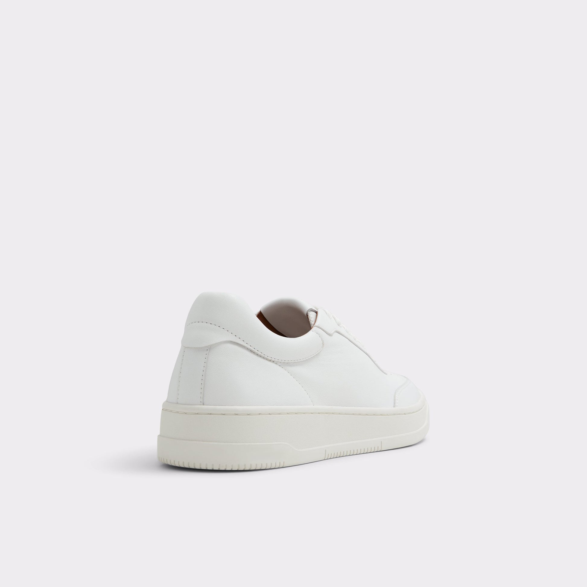 Three-quarter angle of White Baseliner Low top sneaker's back side