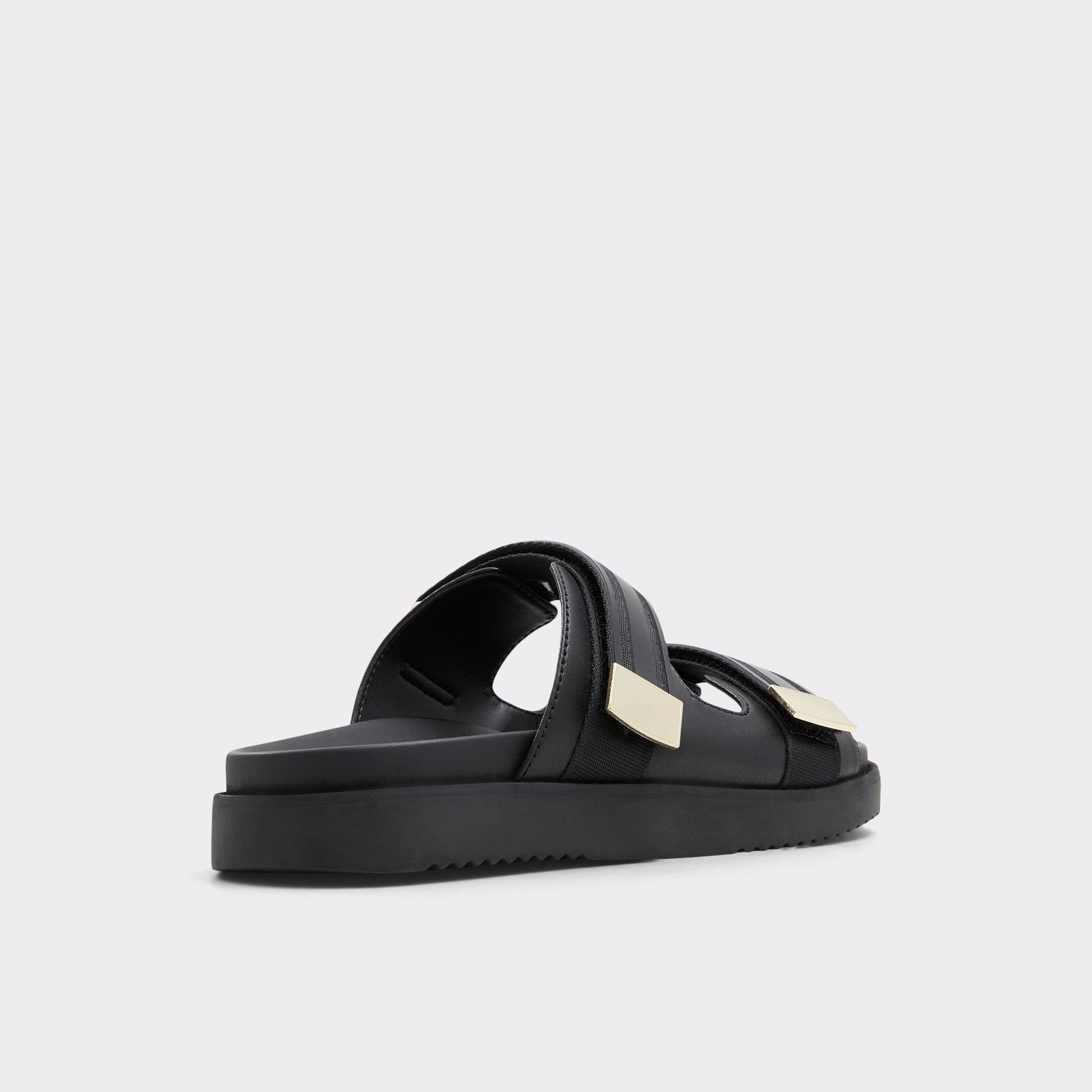 Three-quarter angle of Black Coralina Strappy flat sandal's back side