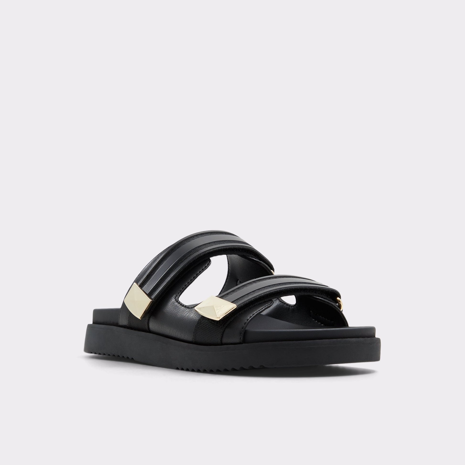Three-quarter angle of Black Coralina Strappy flat sandal's front side