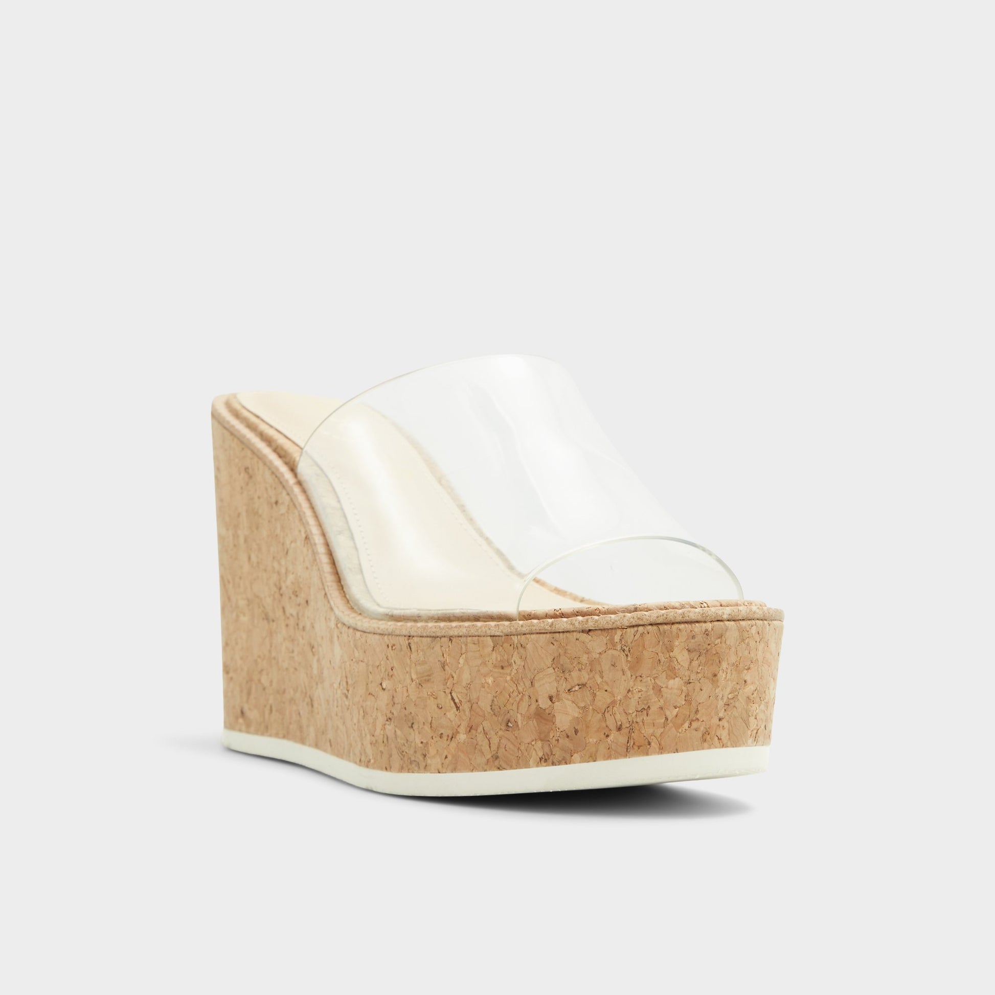 Three-quarter angle of Clear Midsommar Wedge sandal's front side