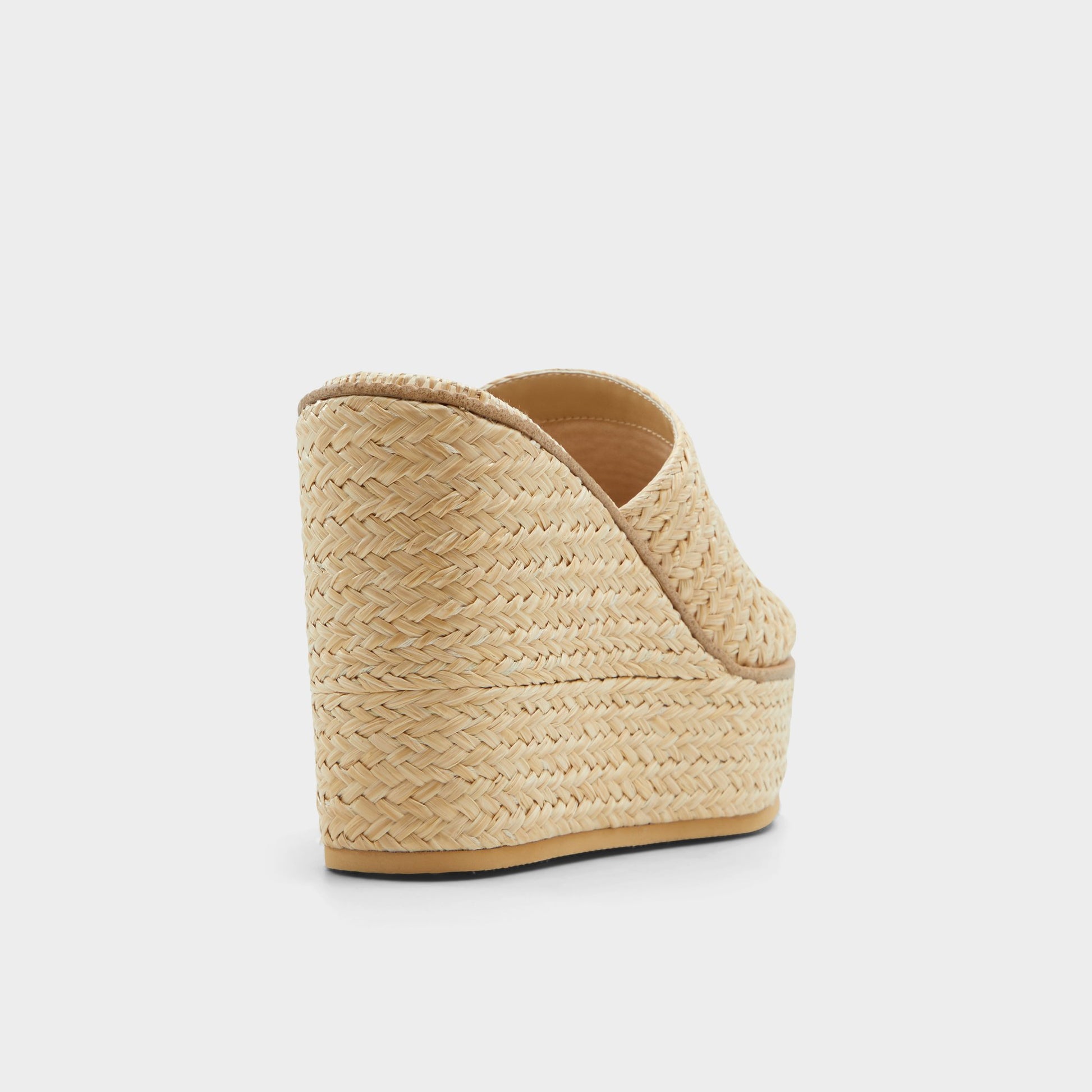 Three-quarter angle of Open Natural Midsommar Wedge sandal's back side