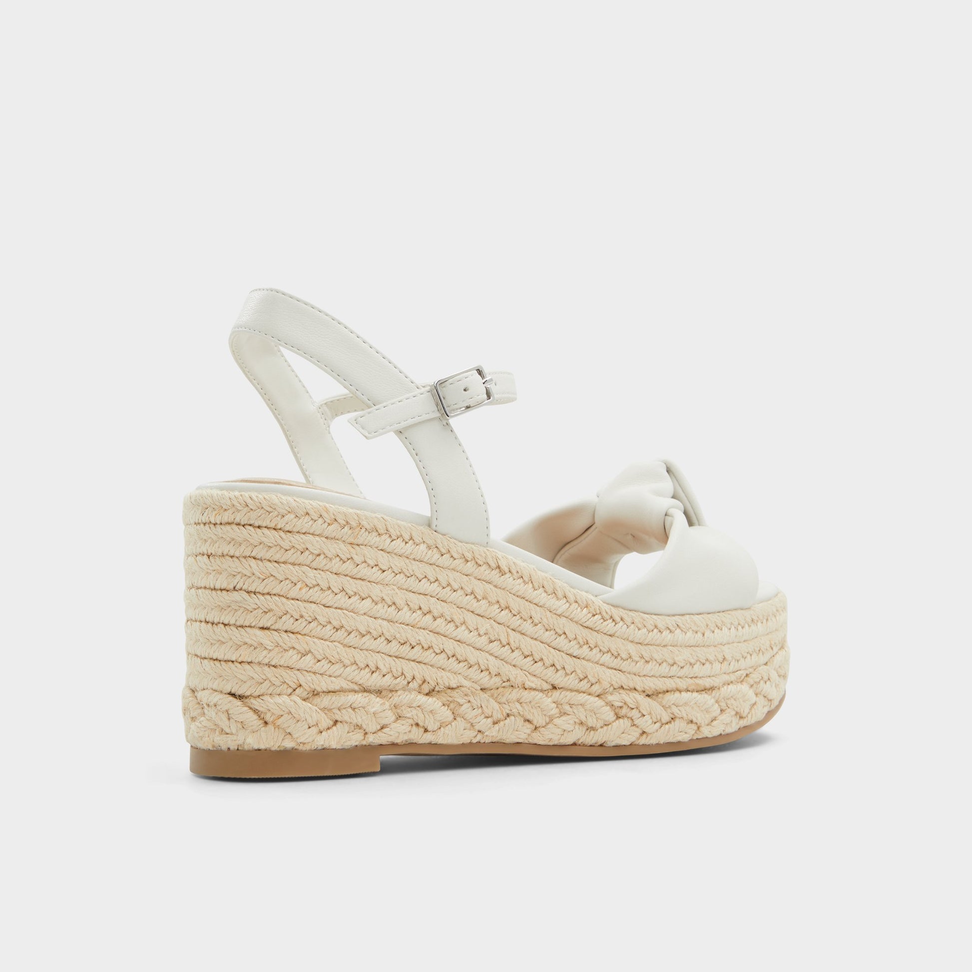 Three-quarter angle of White Annamarie Wedge sandal's back side