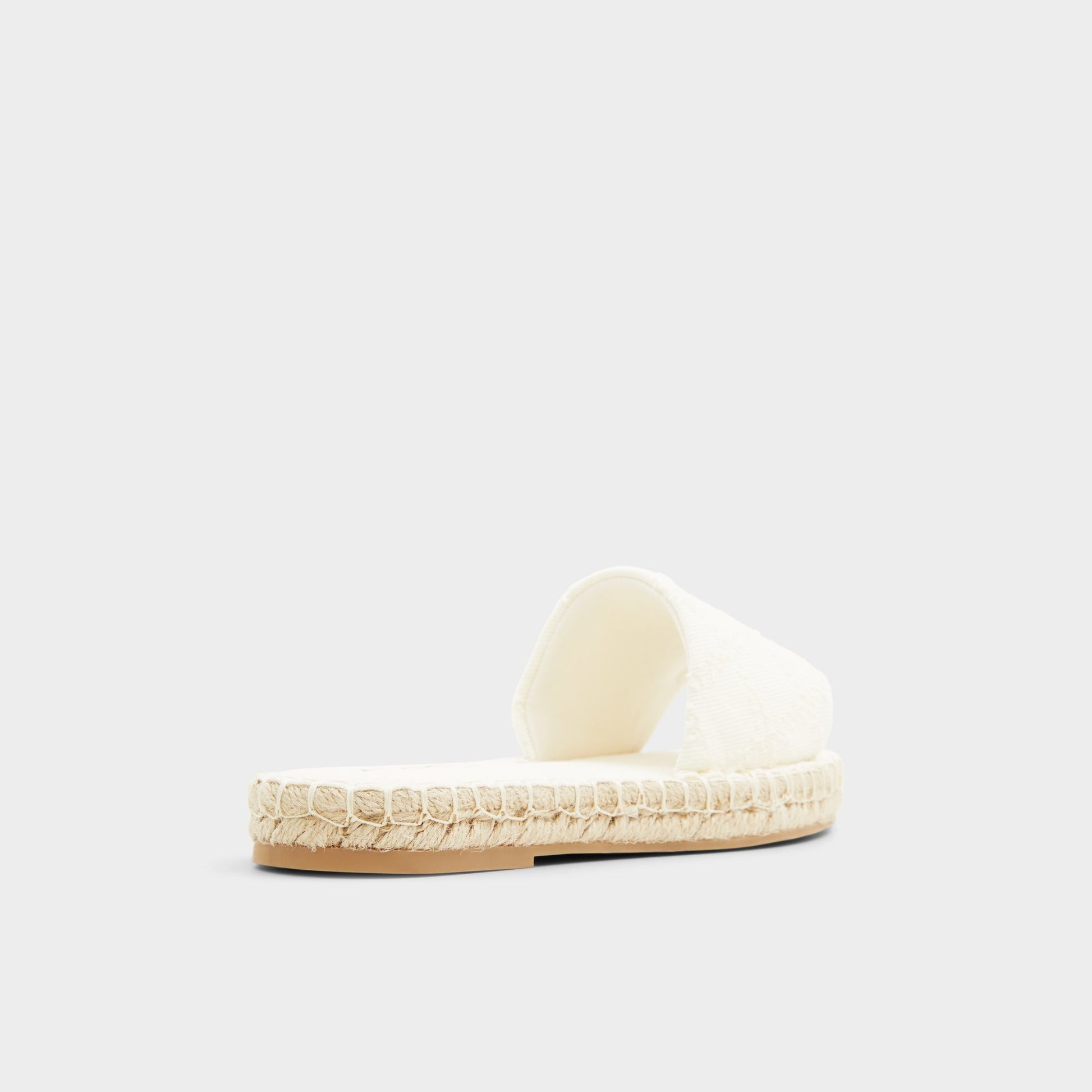 Three-quarter angle of Open Natural Erireni Slide sandal's back side