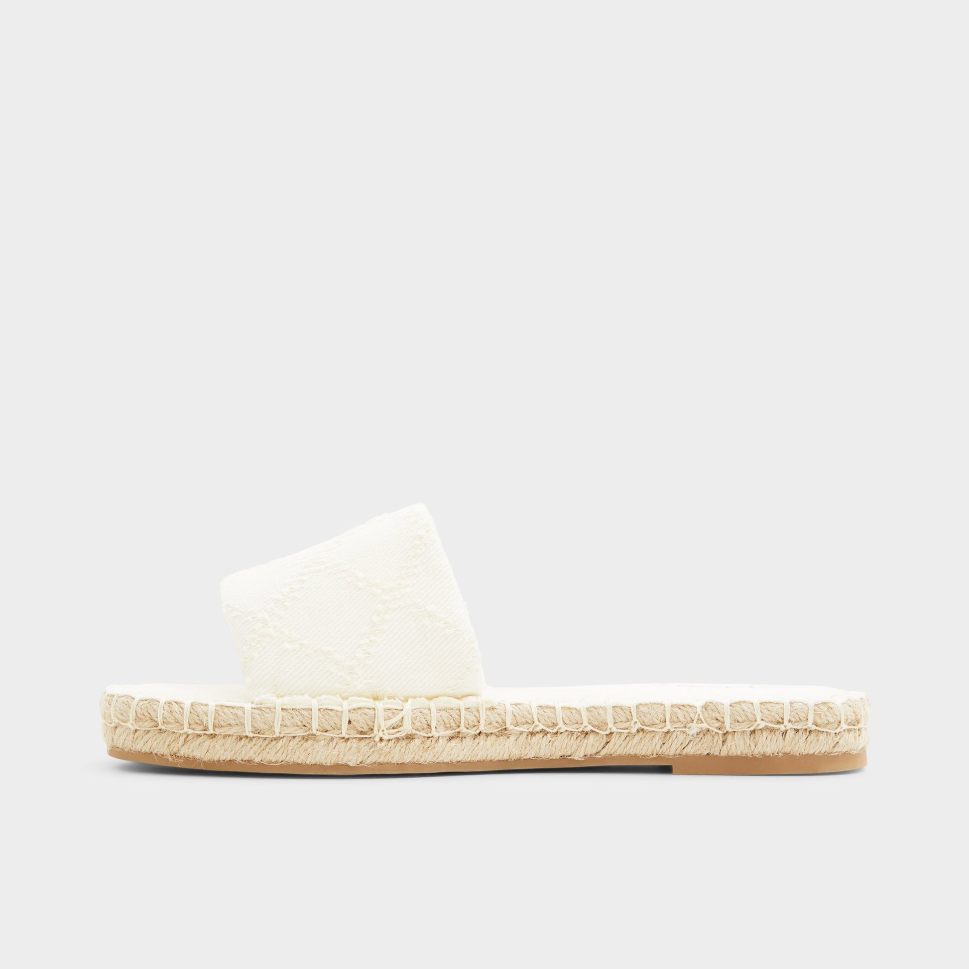 Side view of Open Natural Erireni Slide sandal