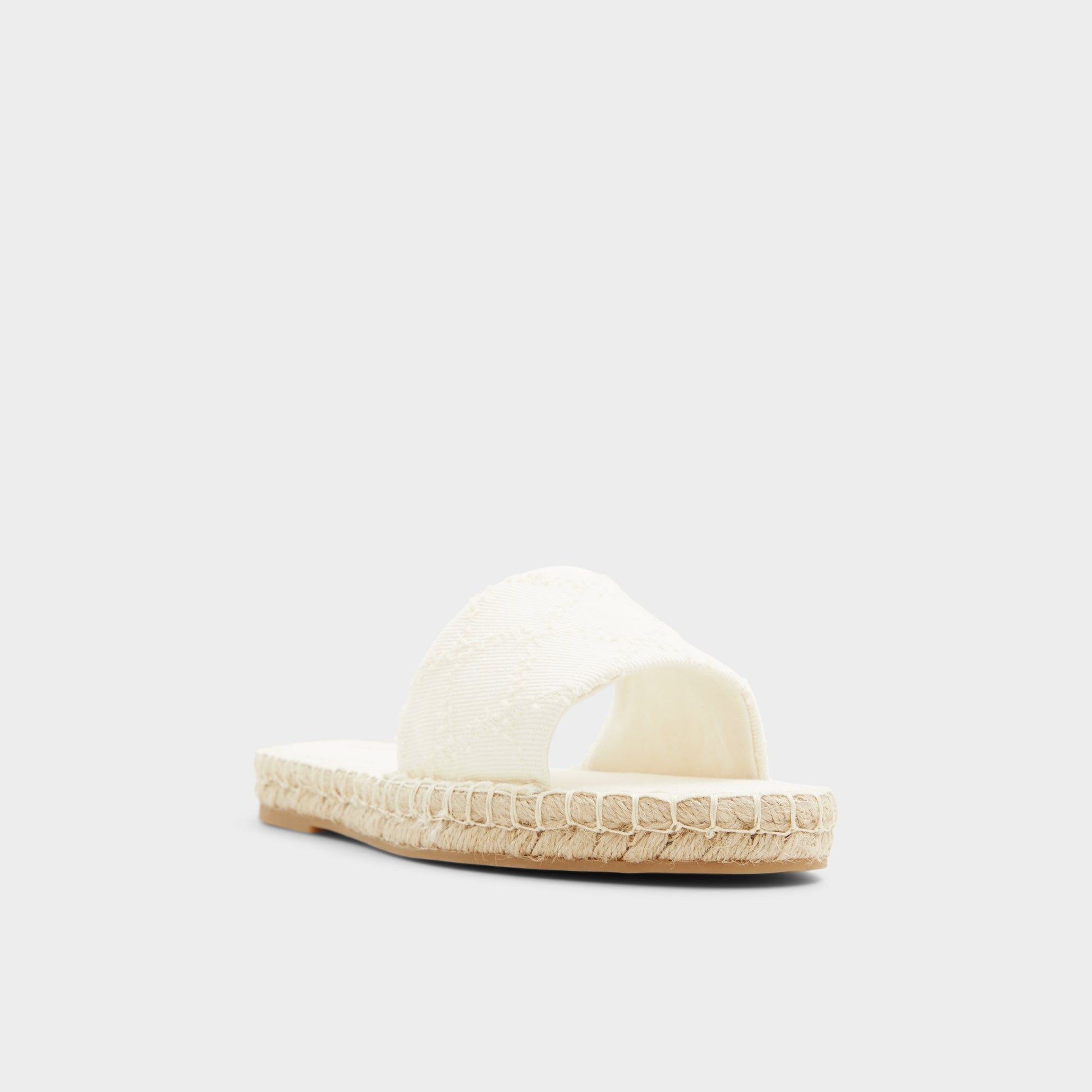 Three-quarter angle of Open Natural Erireni Slide sandal's front side