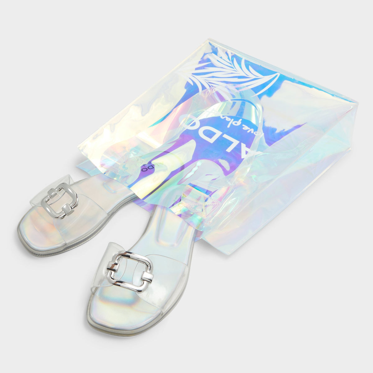 Highlighted view of a pair of Clear Jellyicious Slide sandal &amp; tote bags