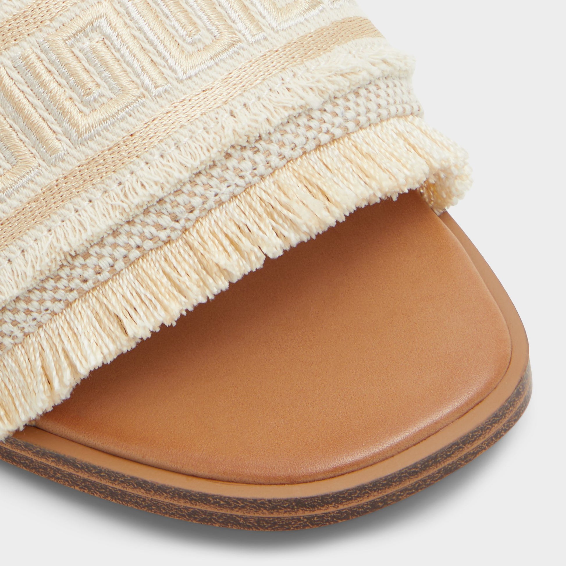Close-up of the Gold Nalani Slide sandal