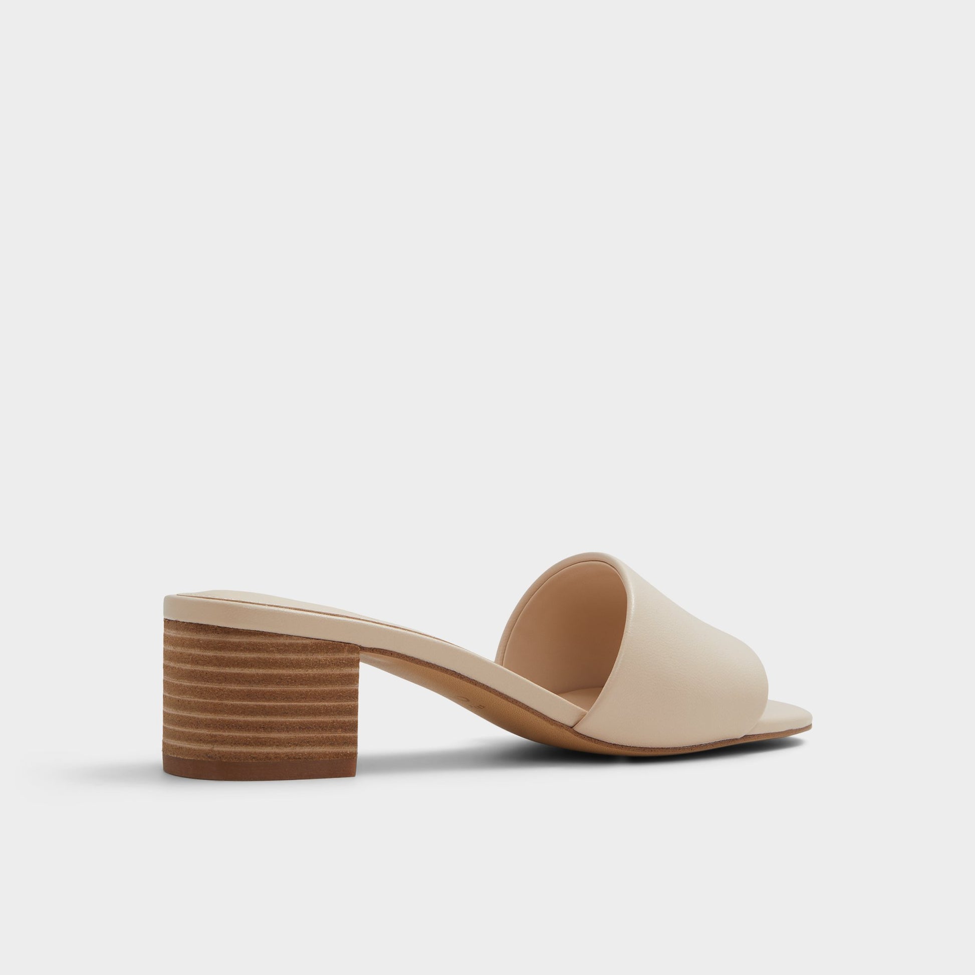 Three-quarter angle of Other Beige Claudina Heeled mule's back side