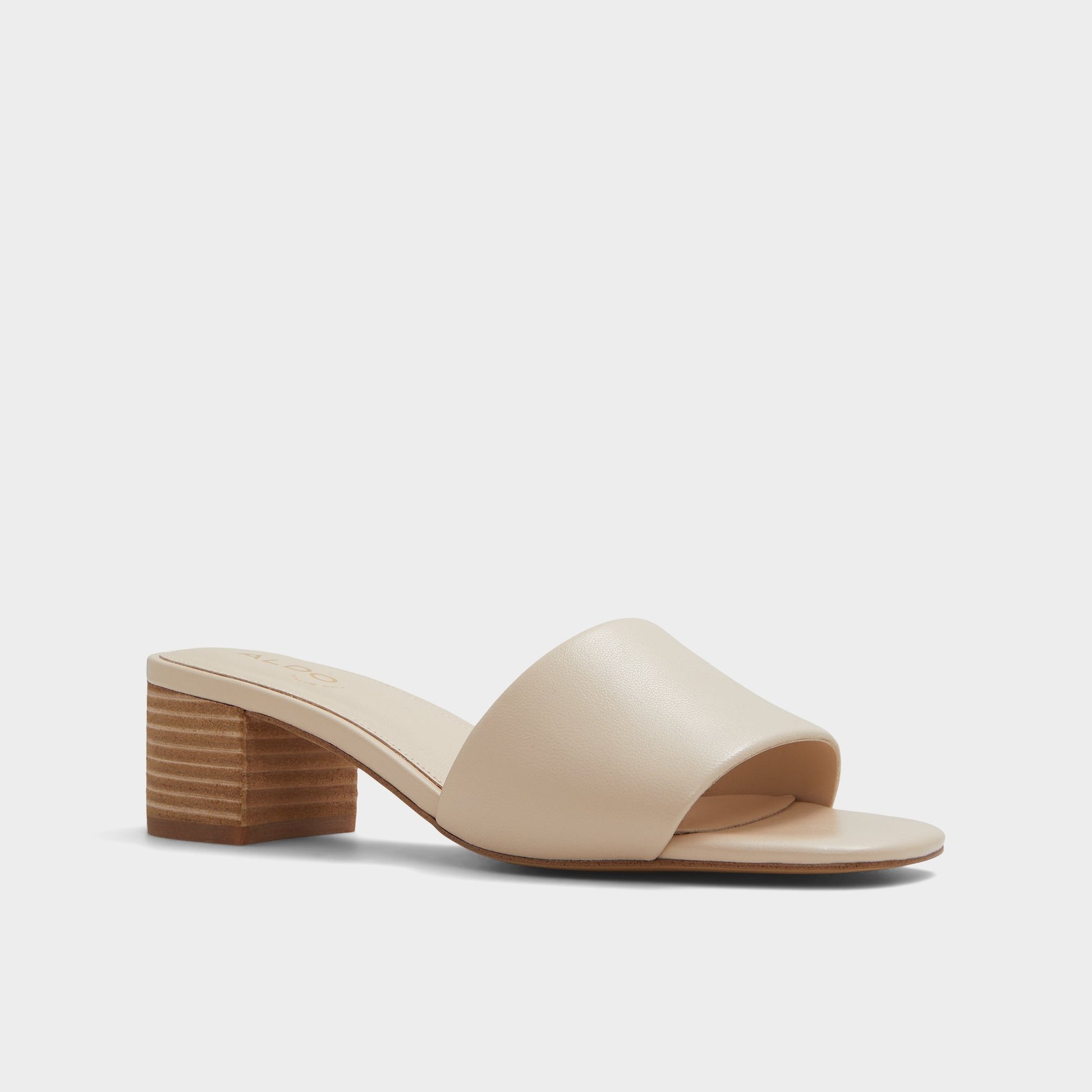 Three-quarter angle of Other Beige Claudina Heeled mule's front side