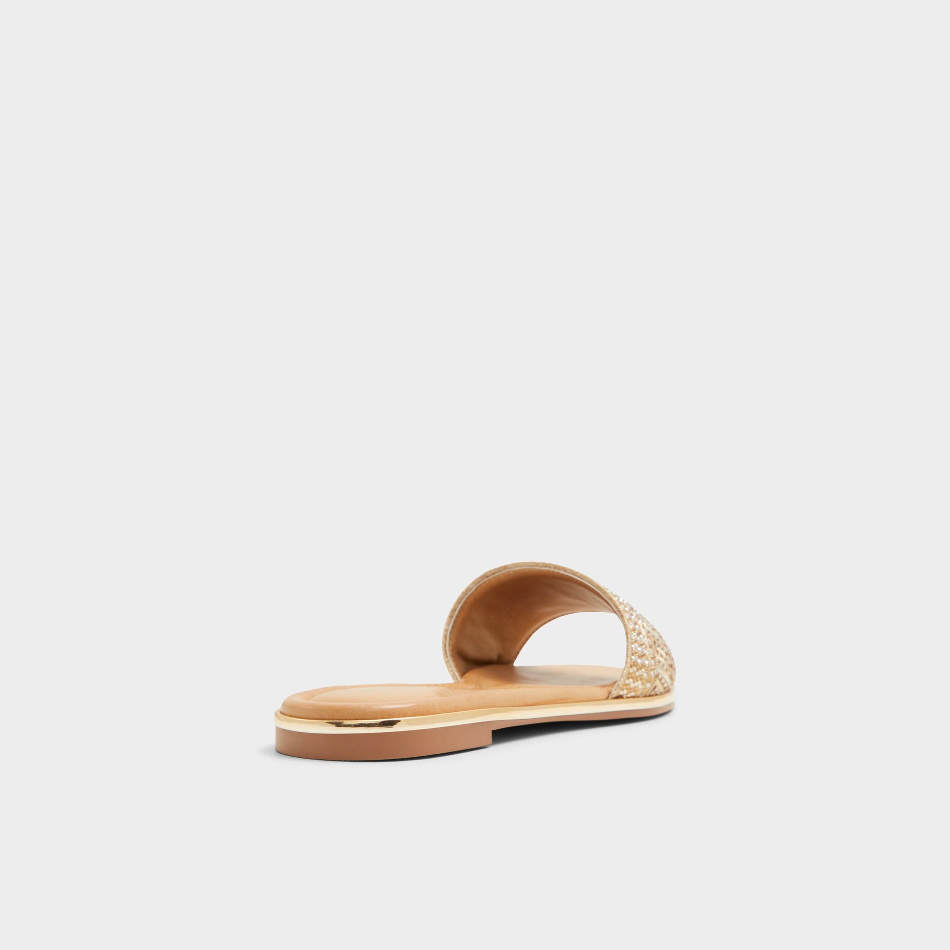 Three-quarter angle of Gold Oceania Slide sandal's back side