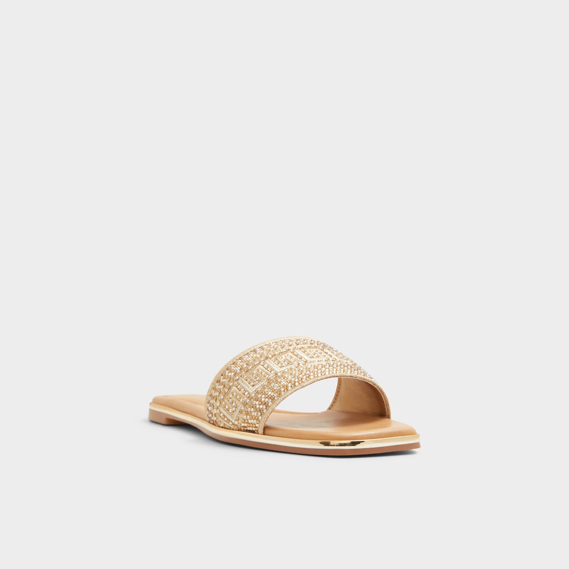 Three-quarter angle of Gold Oceania Slide sandal's front side