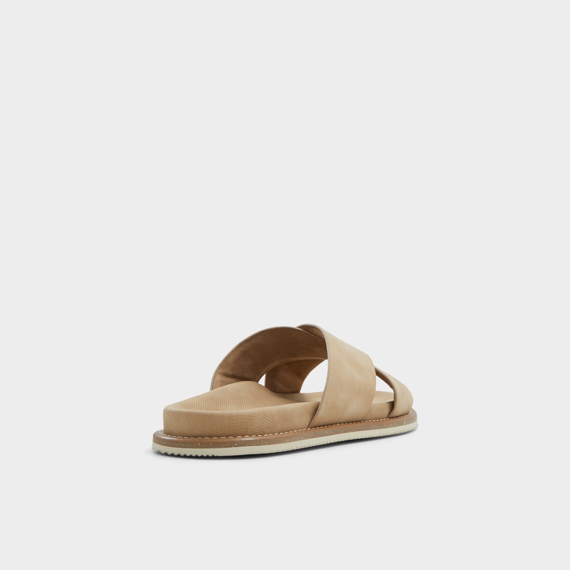 Three-quarter angle of Beige Marrin Slide sandal's back side