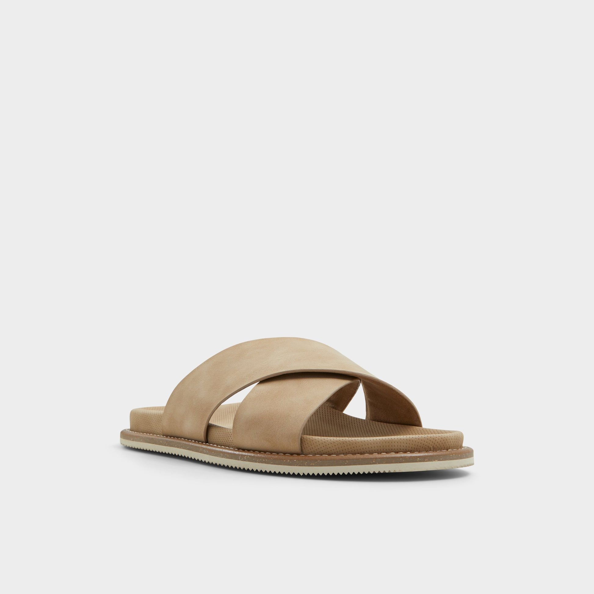 Three-quarter angle of Beige Marrin Slide sandal's front side