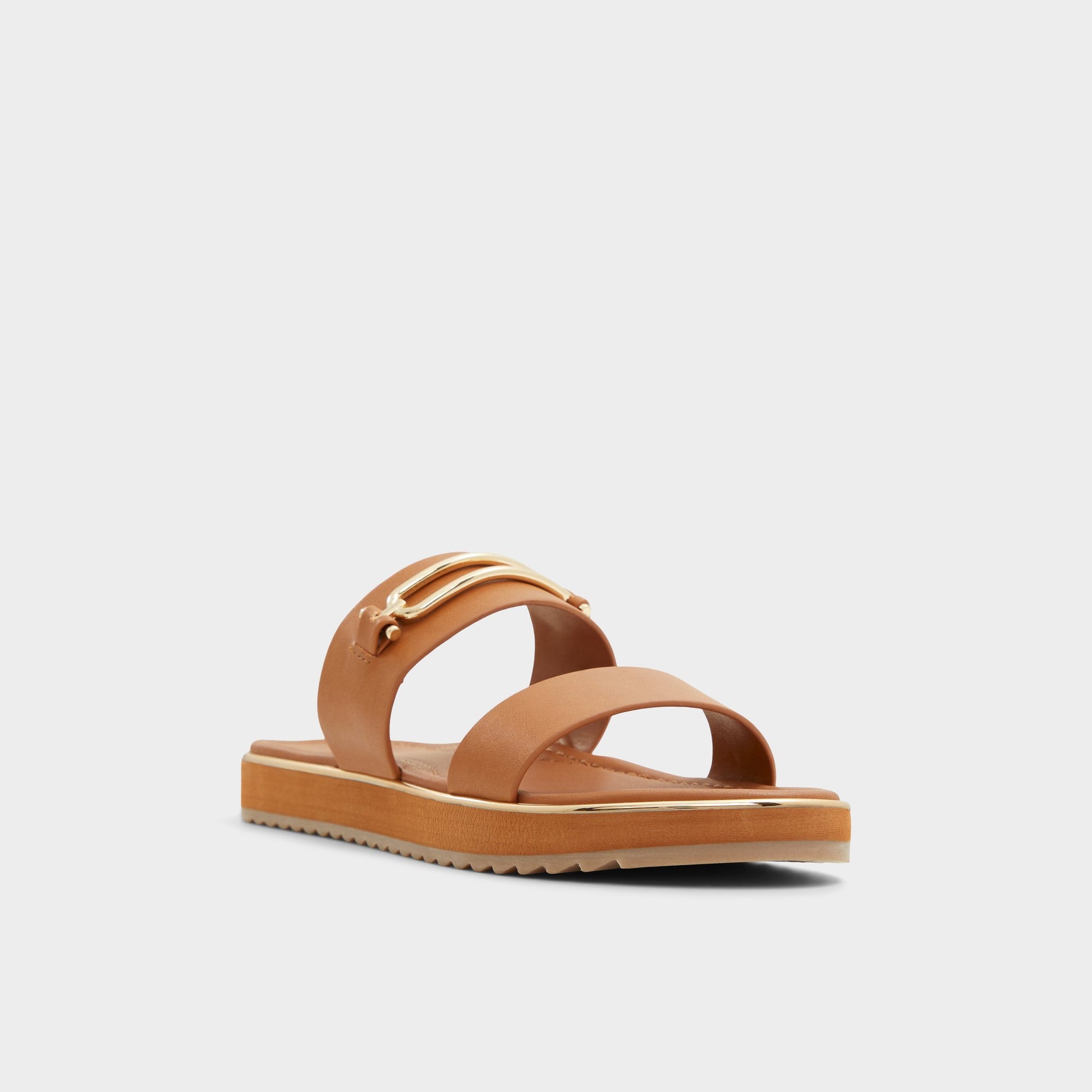 Three-quarter angle of Other Brown Lagoon Strappy flat sandal's front side