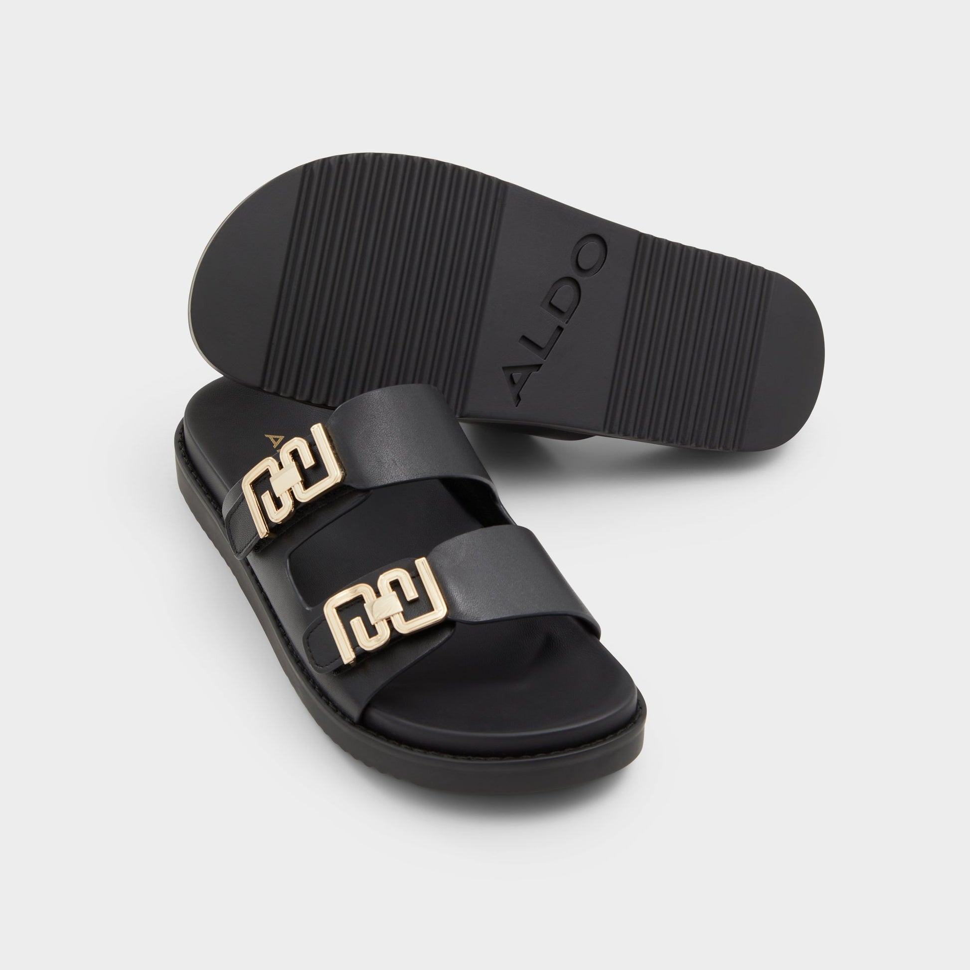 Highlighted view of a pair of Black Alessie Footbed sandals