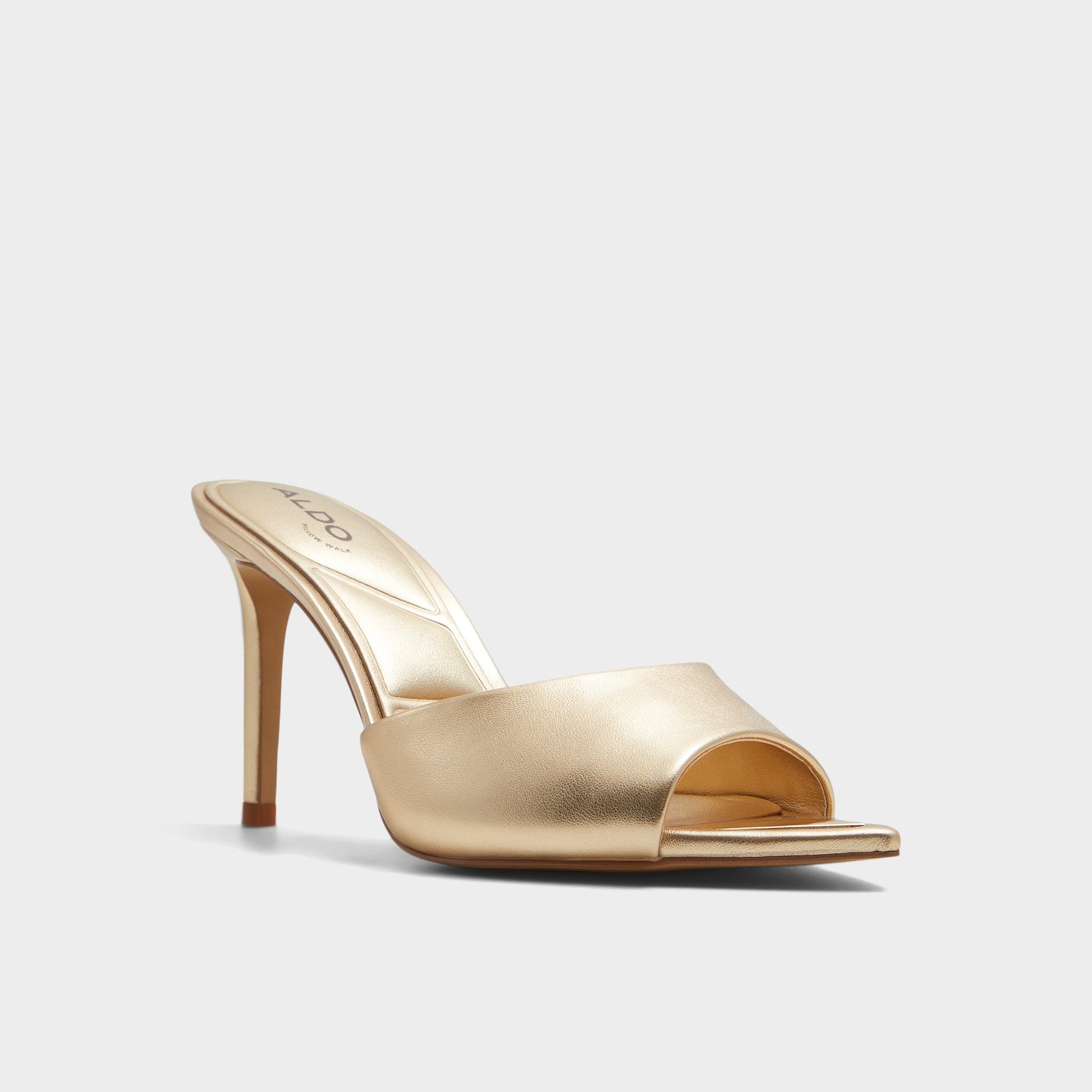Three-quarter angle of Gold Marita Heeled mule's front side