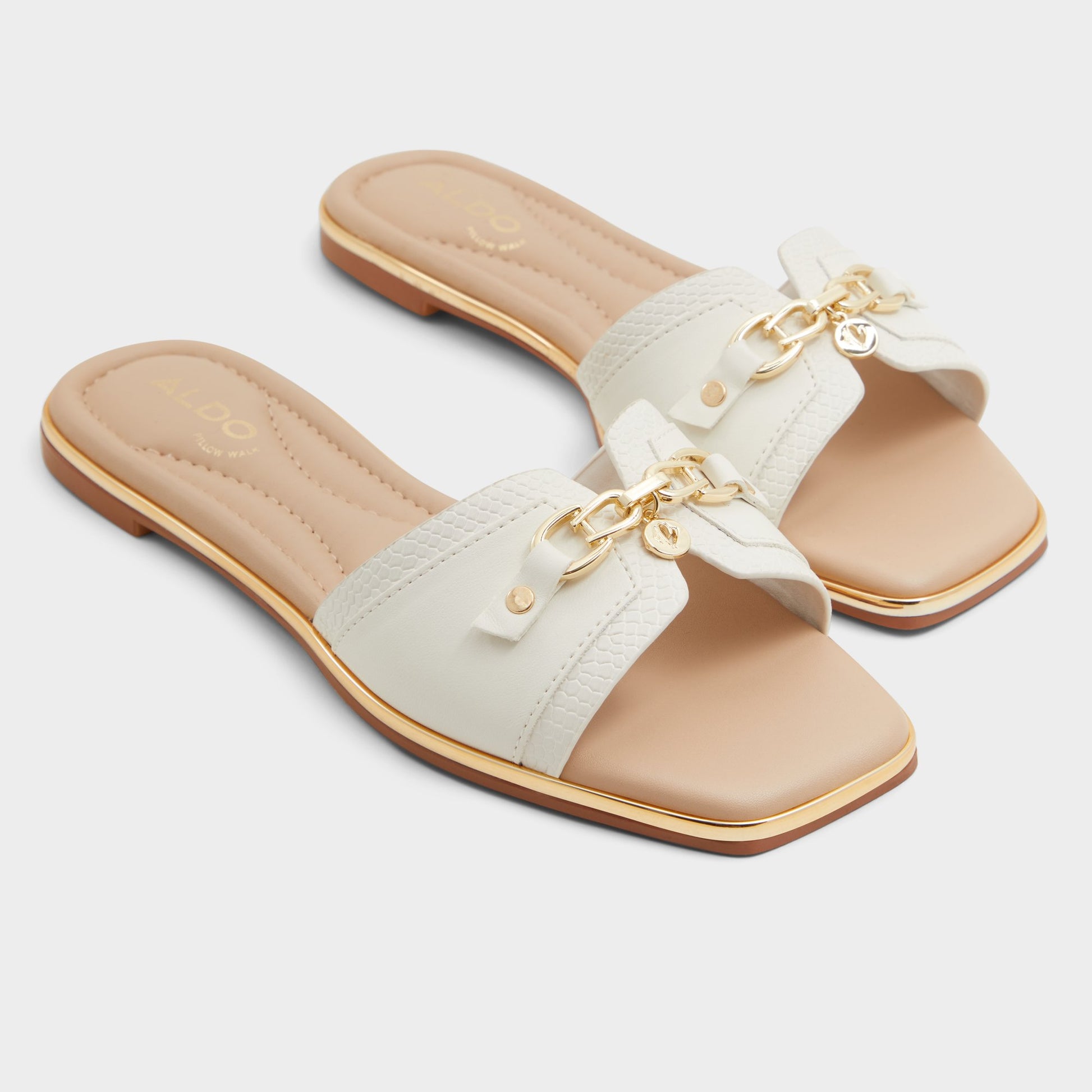 Highlighted view of a pair of Open white Alamassi Slide sandals