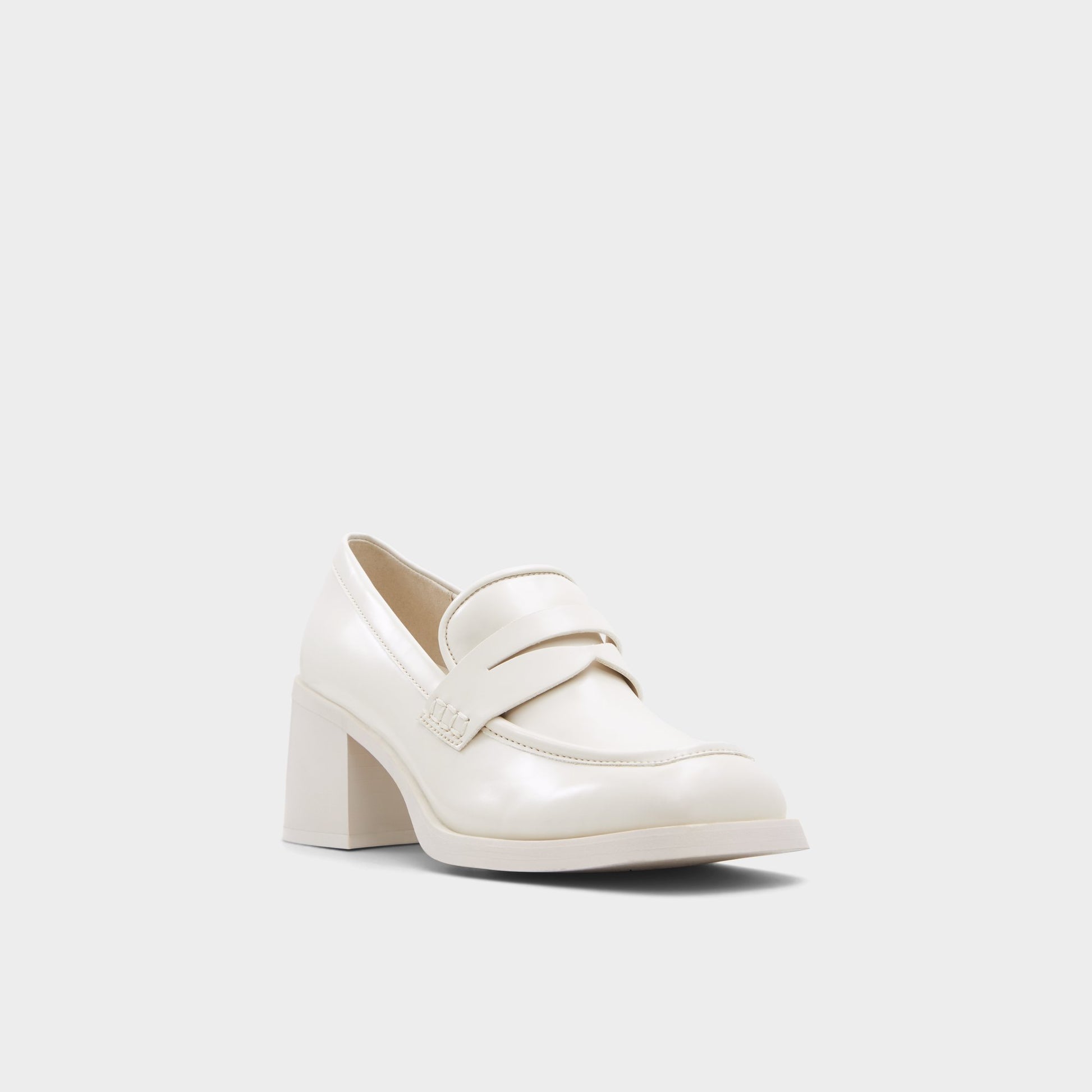 Three-quarter angle of Open White Naila Heeled loafer's front side
