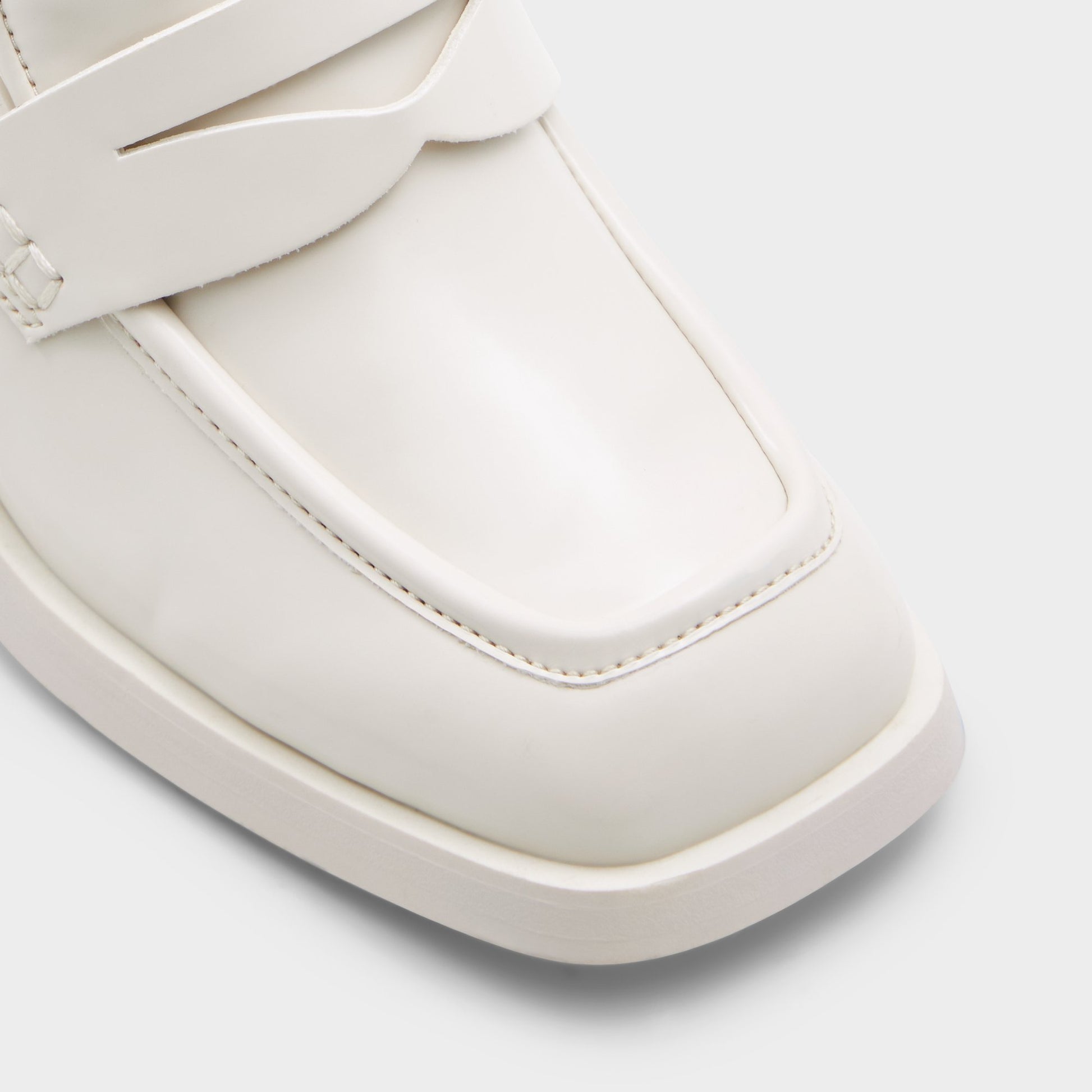 Close-up of the Open White Naila Heeled loafer