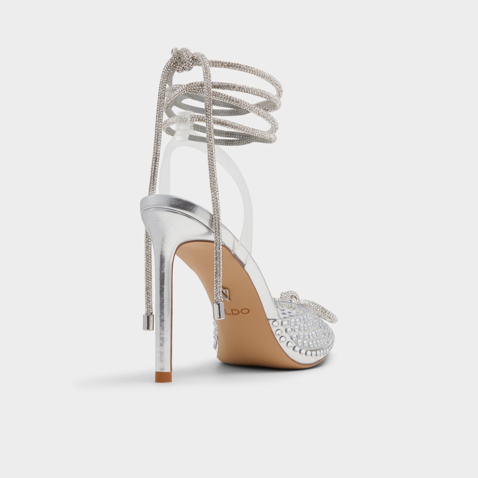 Three-quarter angle of Silver Tenzin Strappy heeled shoe's back side