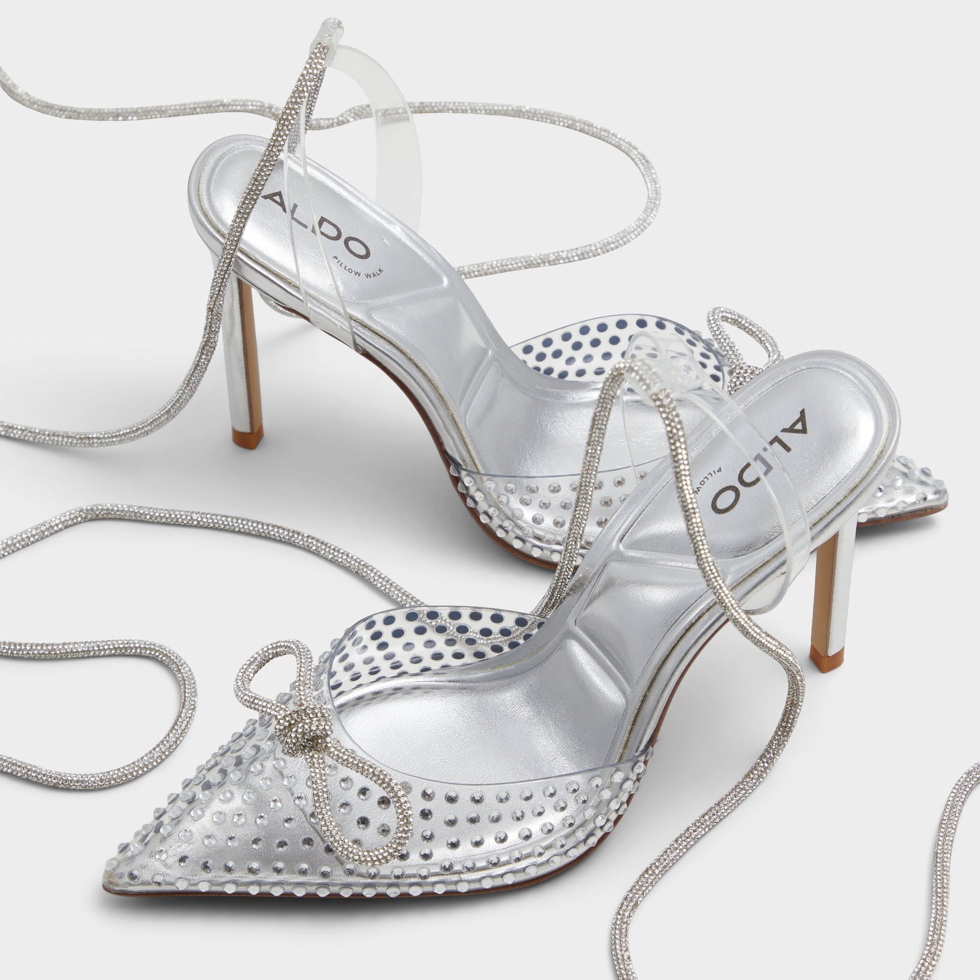 Highlighted view of a pair of Silver Tenzin Strappy heeled shoes