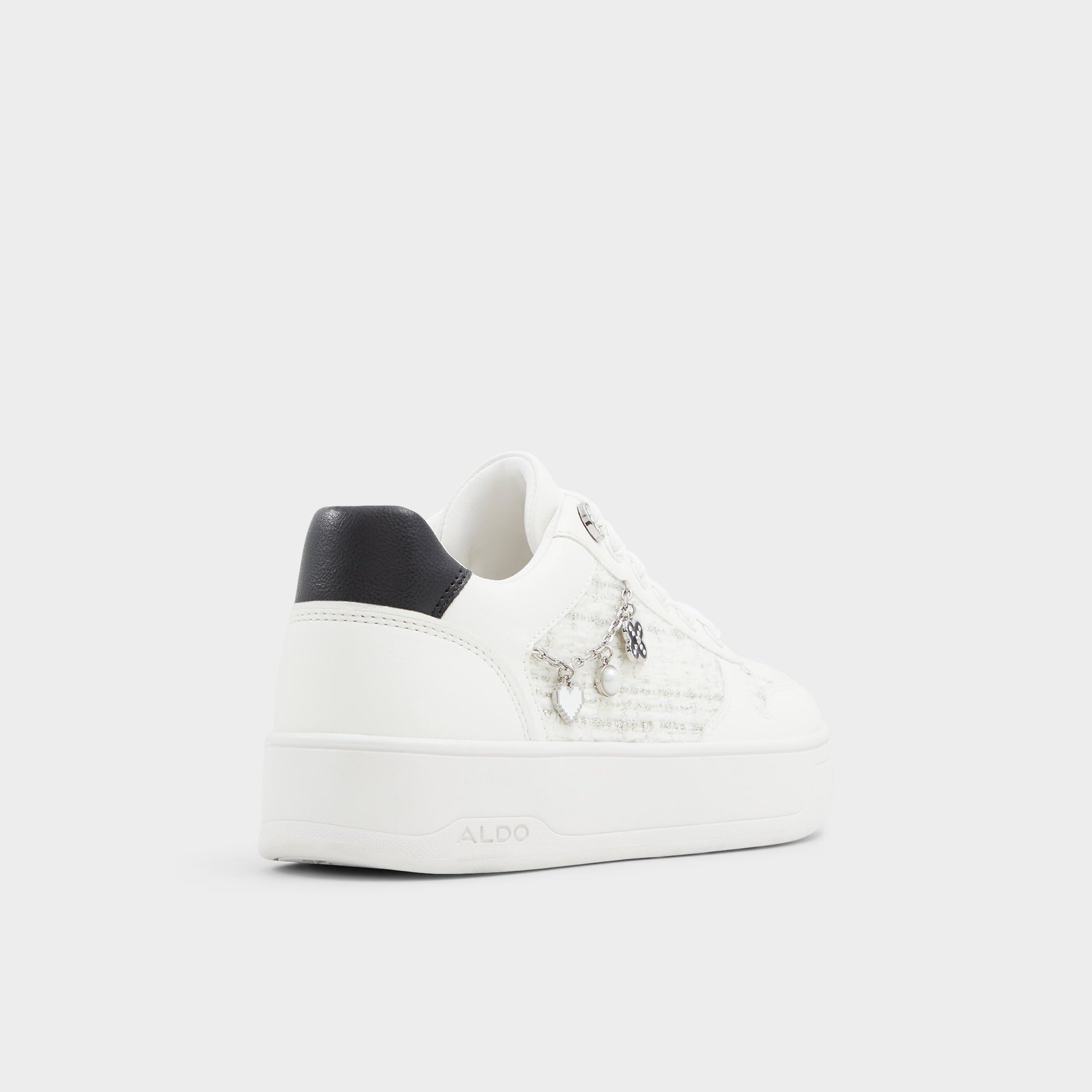 Three-quarter angle of White/black Marisette Low top sneaker's back side