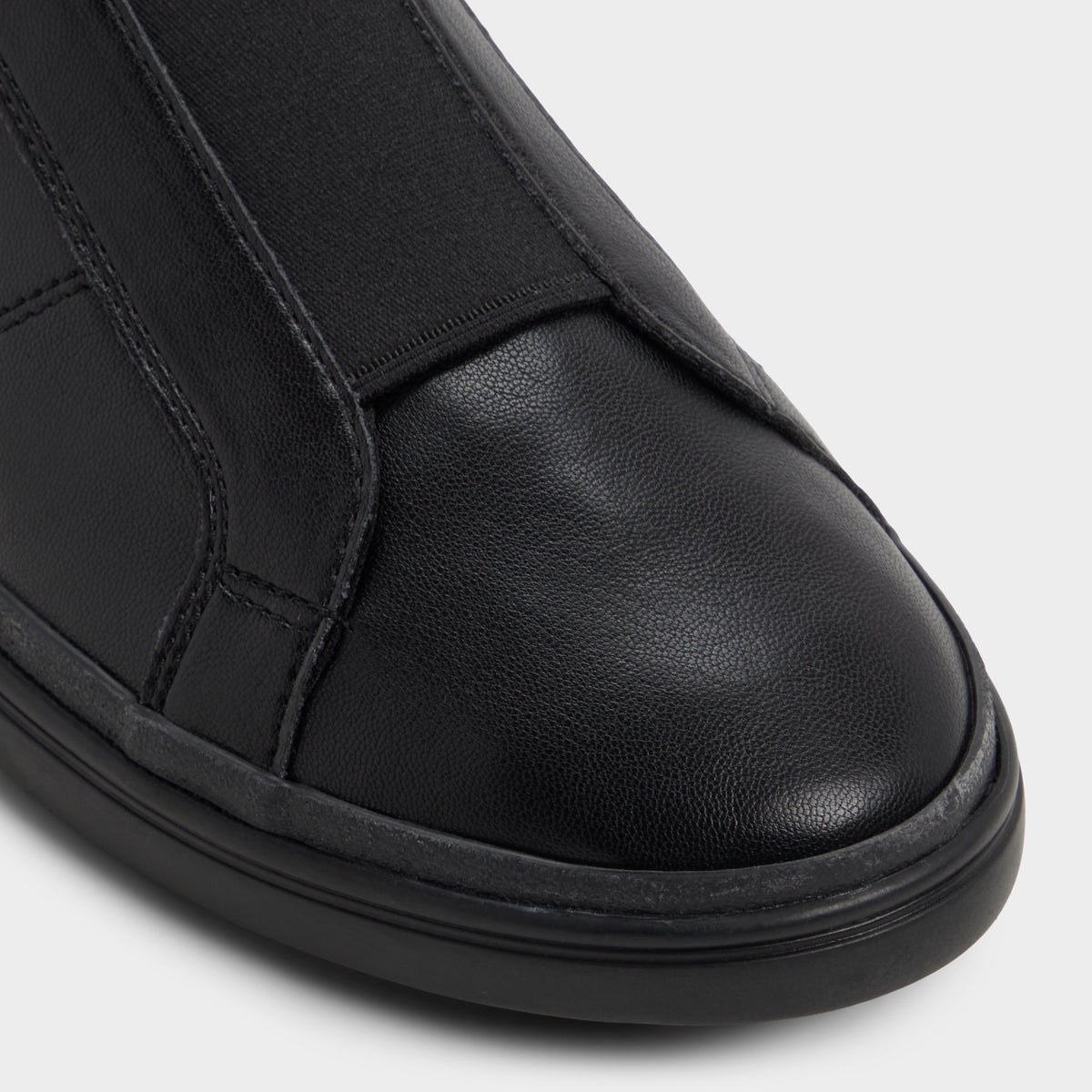 Close-up of the Black/black Aros Slip-on sneaker