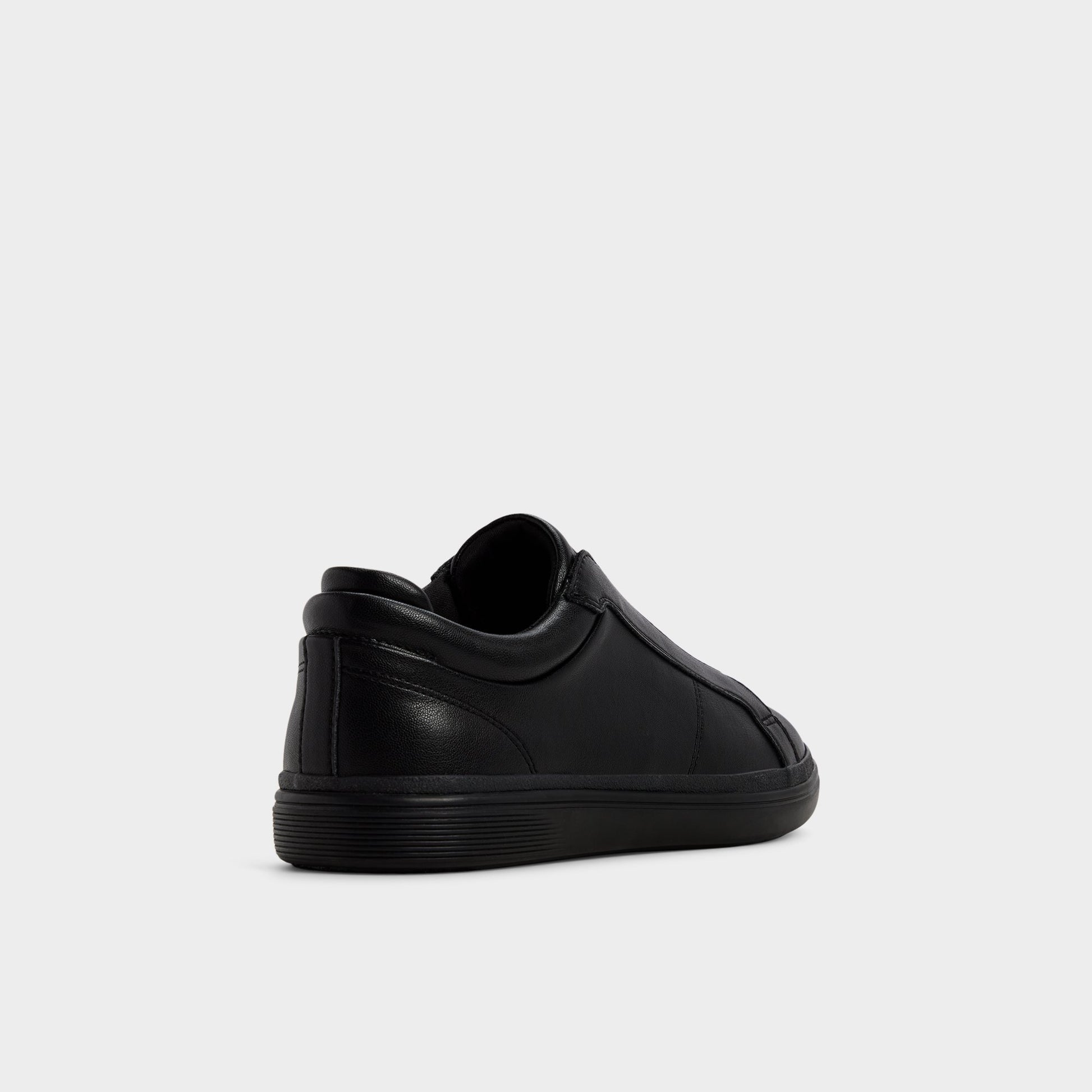 Three-quarter angle of Black/black Aros Slip-on sneaker's back side