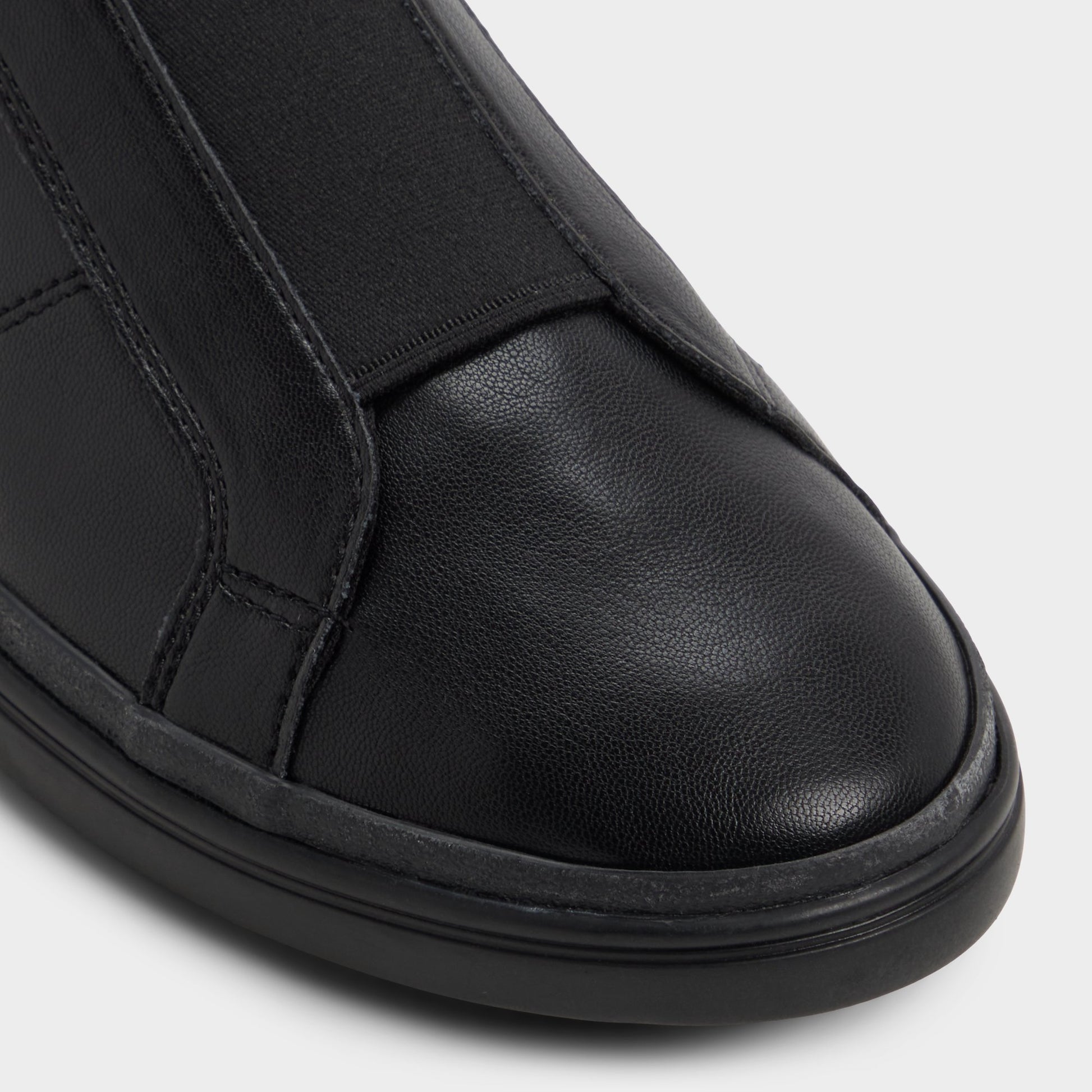 Close-up of the Black/black Aros Slip-on sneaker
