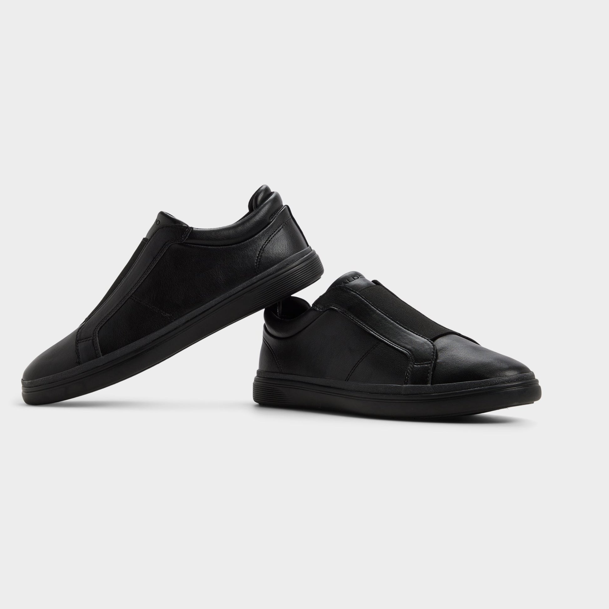 Highlighted view of a pair of Black/black Aros Slip-on sneakers
