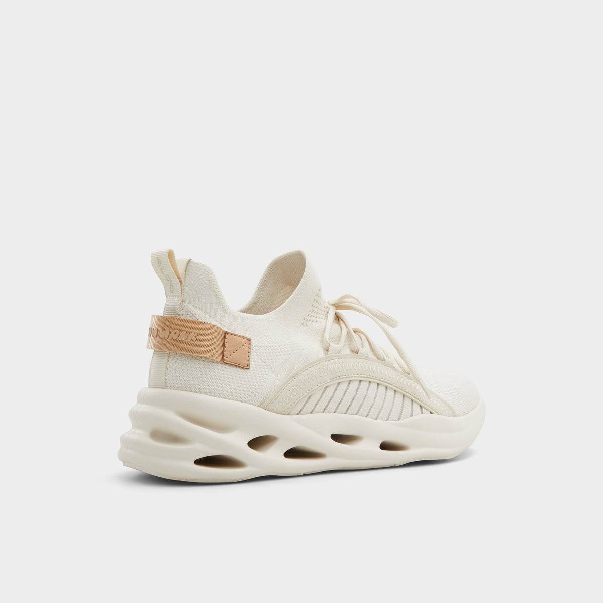 Three-quarter angle of White/Bone Motionx Jogger sneaker's back side