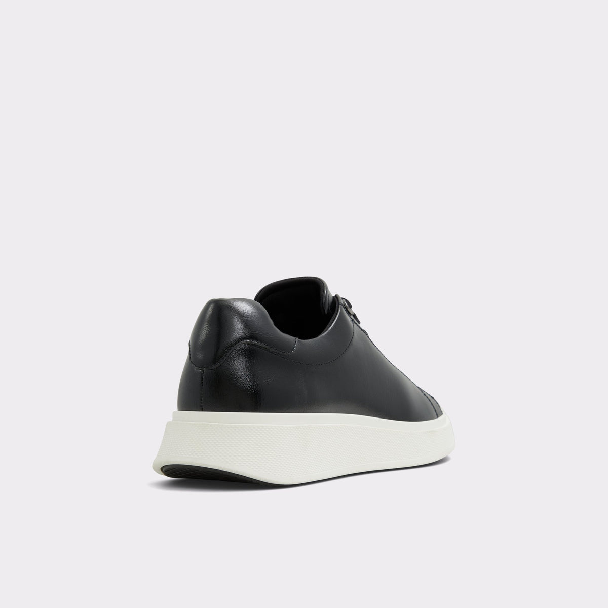 Three-quarter angle of Black/Black Magnus Low top sneaker's back side