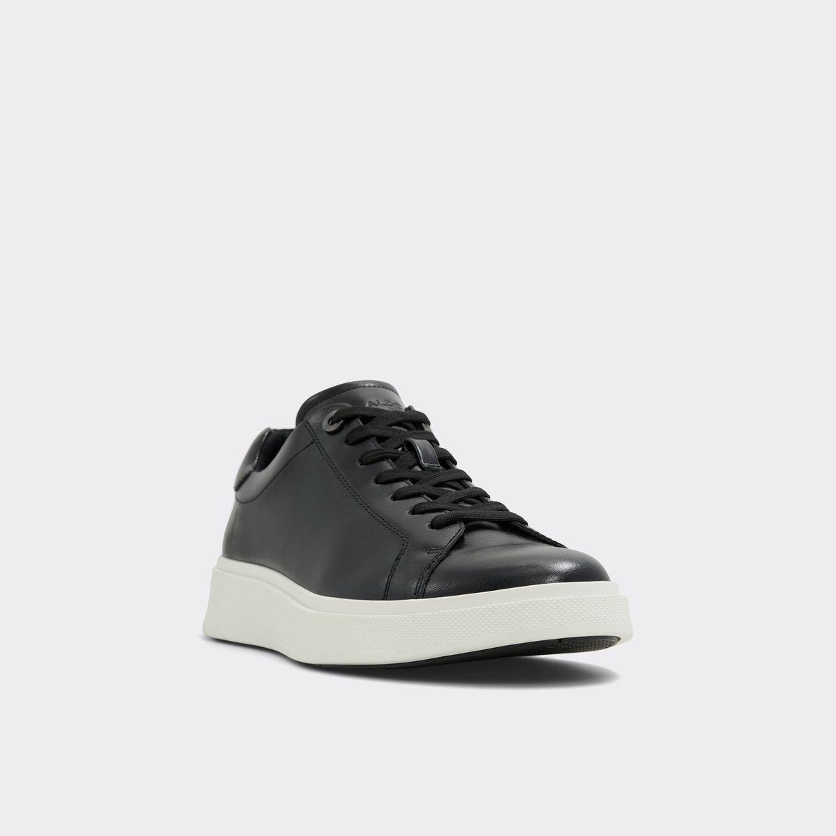Three-quarter angle of Black/Black Magnus Low top sneaker's front side
