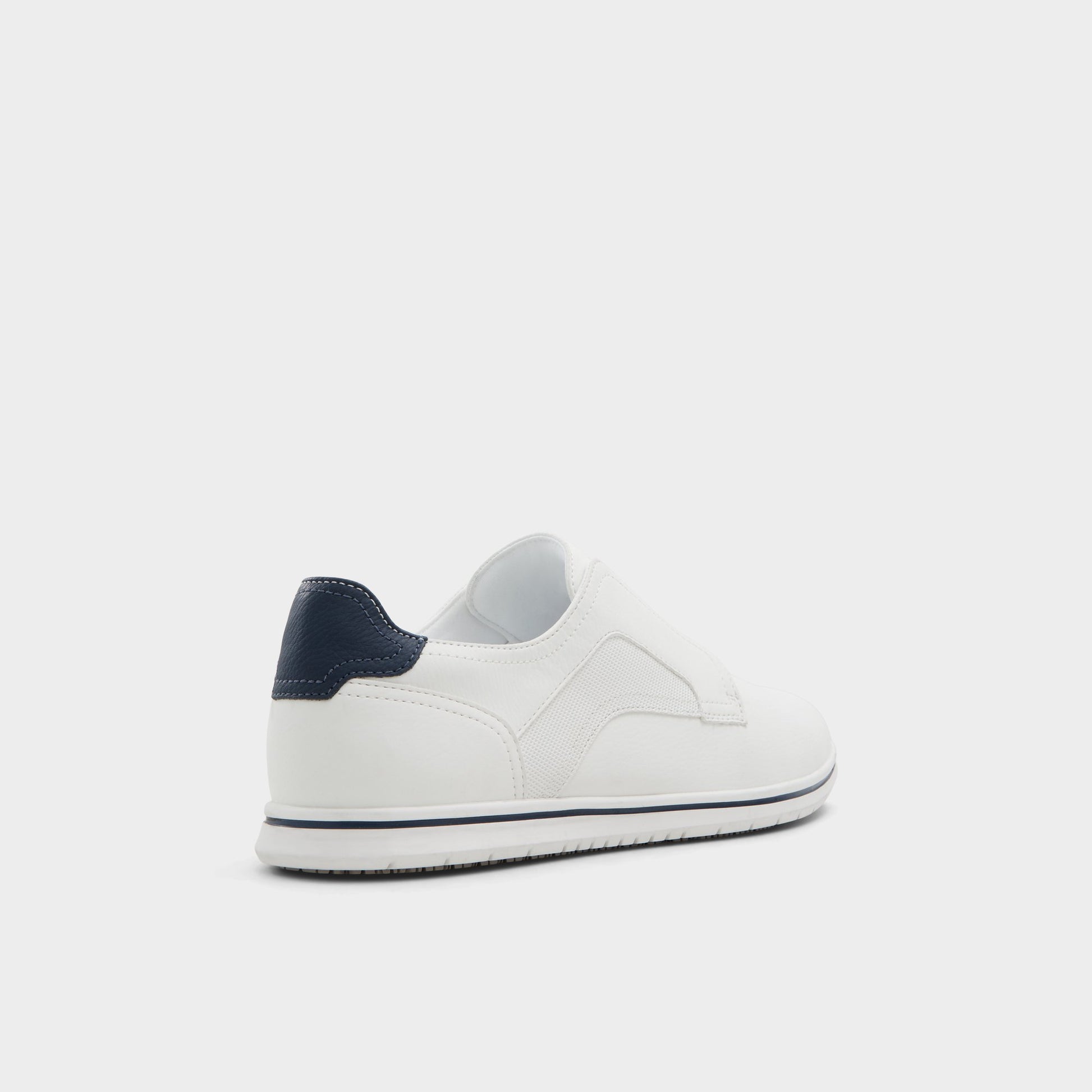 Three-quarter angle of White Onalith Slip-on's back side